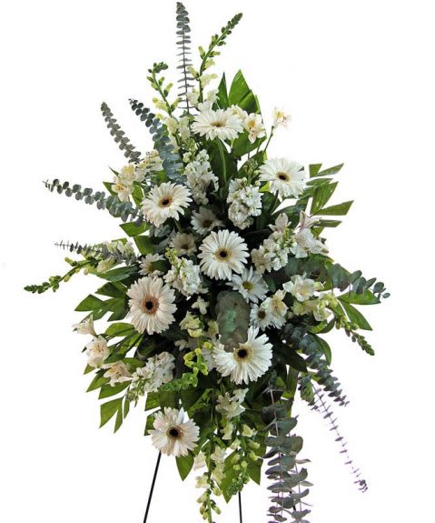 White gerbera daisy standing spray with mixed greenery