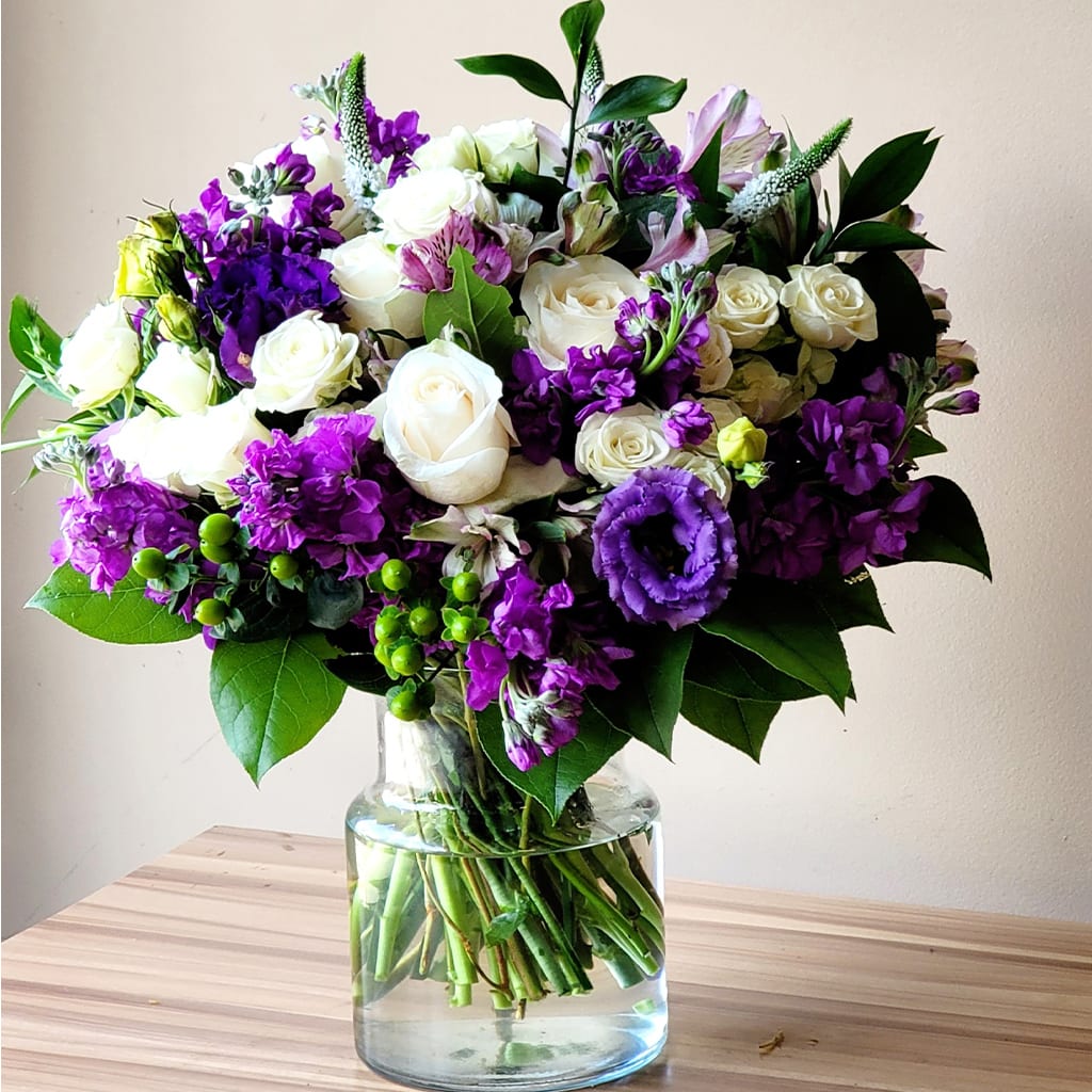 Borahae Bouquet - Inspired by the Korean phrase “Borahae” meaning “I purple you,” this bouquet symbolizes love, trust, and lasting affection.   Featuring white roses, purple stock, white veronica, and lisianthus, it’s a charming mix of elegance and warmth.  Approximate Size: 18" H x 15" W. Order now to share this heartfelt sentiment! 