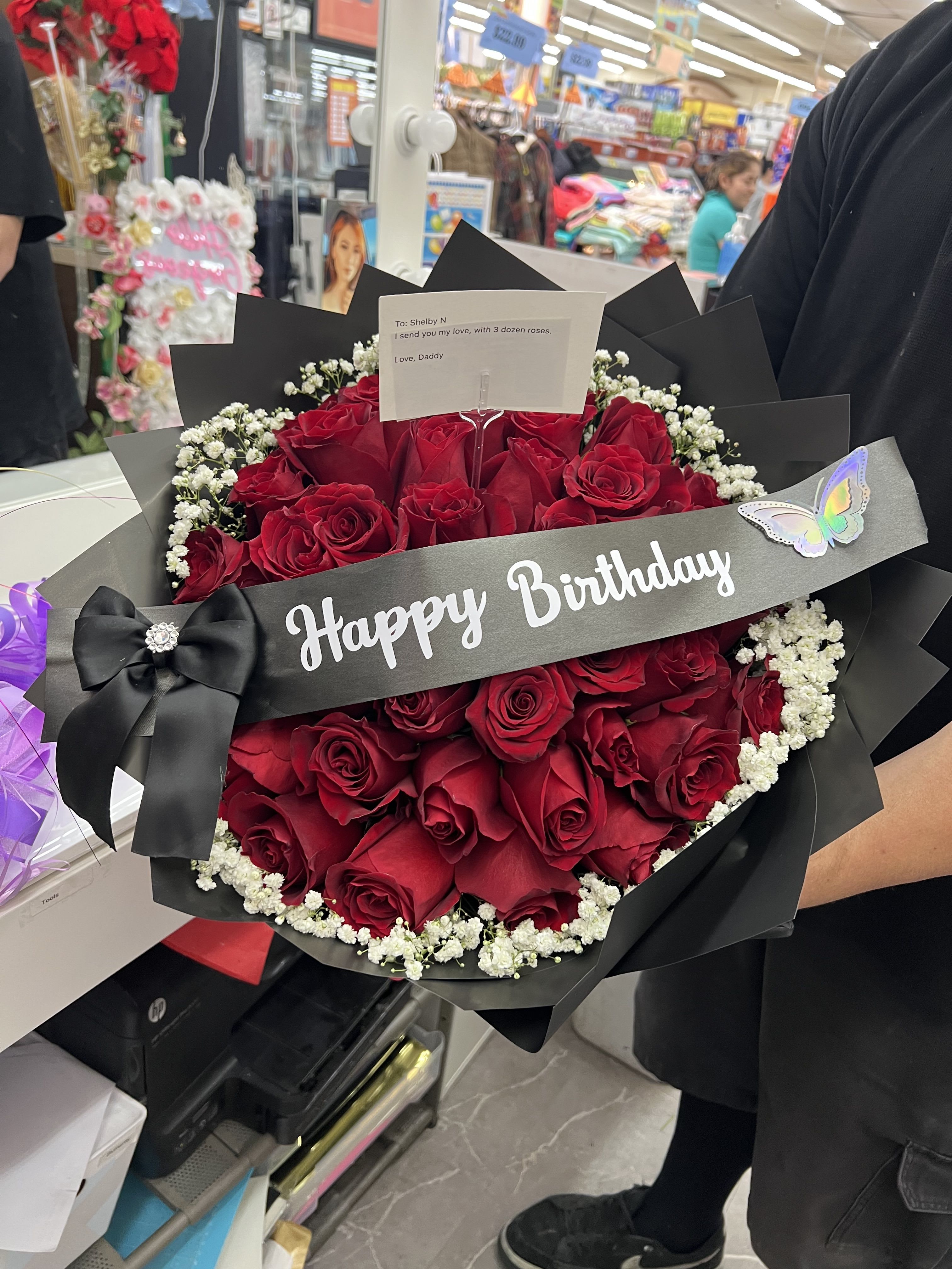 Bouquet of red roses with baby's breath and a Happy Birthday ribbon