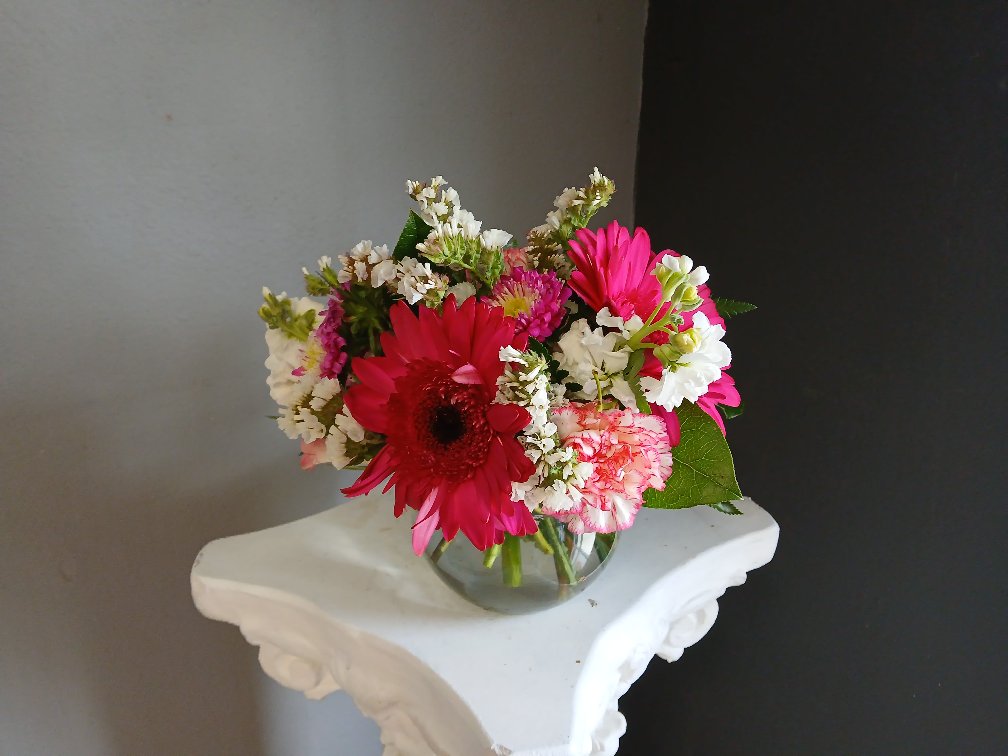 #702 Designer's Choice Vase Arrangement - This beautiful flower arrangement of fresh mixed seasonal blooms is made by local designers in the heart Orange California. Hand crafted and perfect for every occasion, from birthdays and new babies to sympathy and just because. The best choice to show you are thinking of that special someone. Can be sent as a local delivery or in-store pickup. This is an original, one of a kind arrangement. Order now before it's too late!  UPGRADES: All upgrades are applied at the designer’s discretion and fulfilled to value using the freshest seasonal and/or premium flowers available. Container upgrades may be included when possible; otherwise, value is reflected in the floral selection while maintaining the original design style.