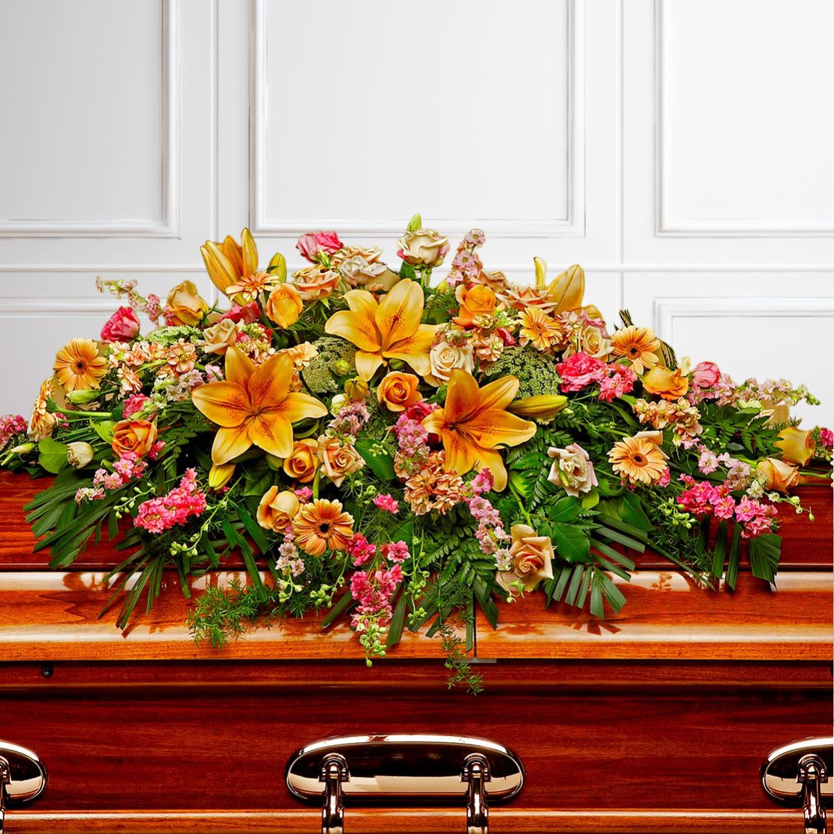 Pink, Yellow, and Orange Full-Size Casket Spray - Pay your respects with a divine mix of pink and yellow blossoms combined with greenery in this classic casket spray. A lovely way to express hope and sympathy.  *Can also be designed in a half-size (open-casket) spray. Please call for pricing. 