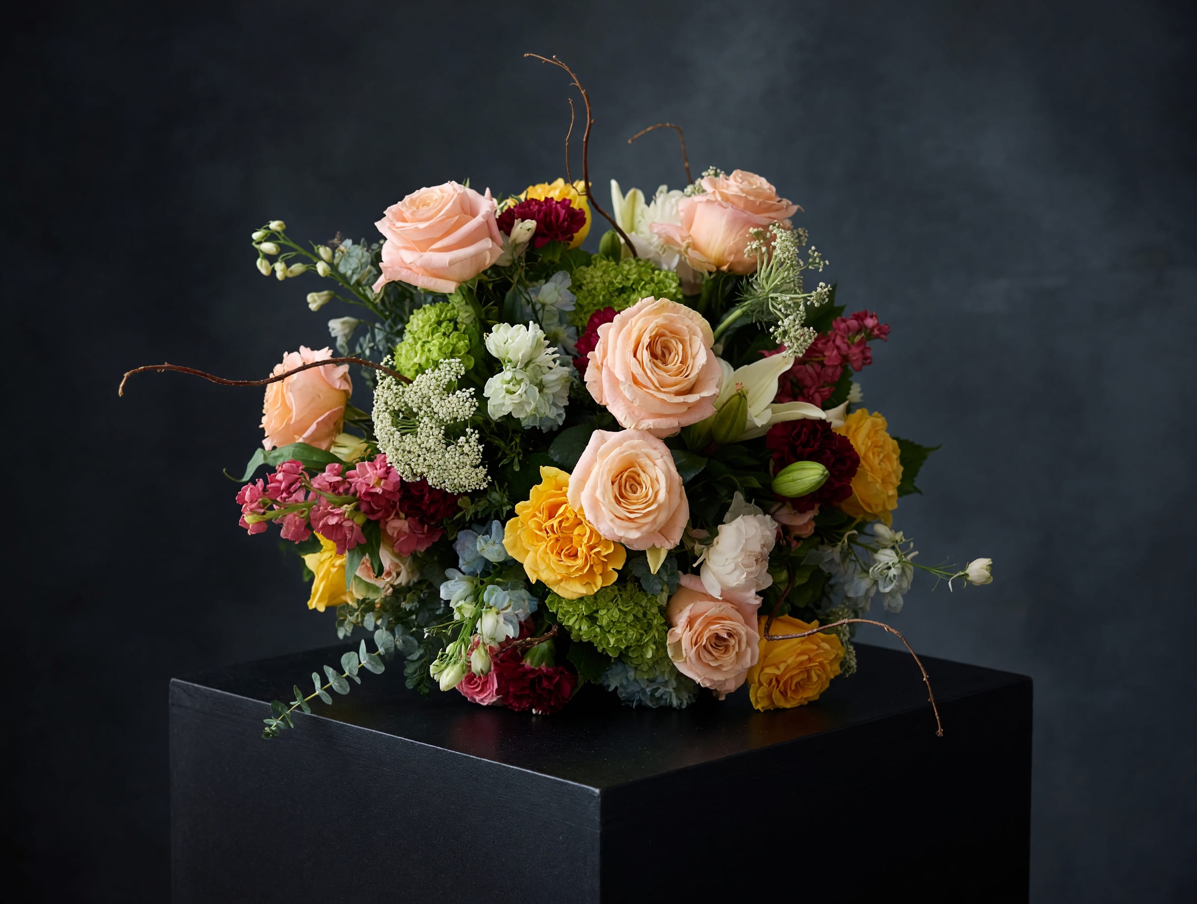 Moody Tweed - Moody Tweed brings together romance and artistry in a one-of-a-kind floral statement.