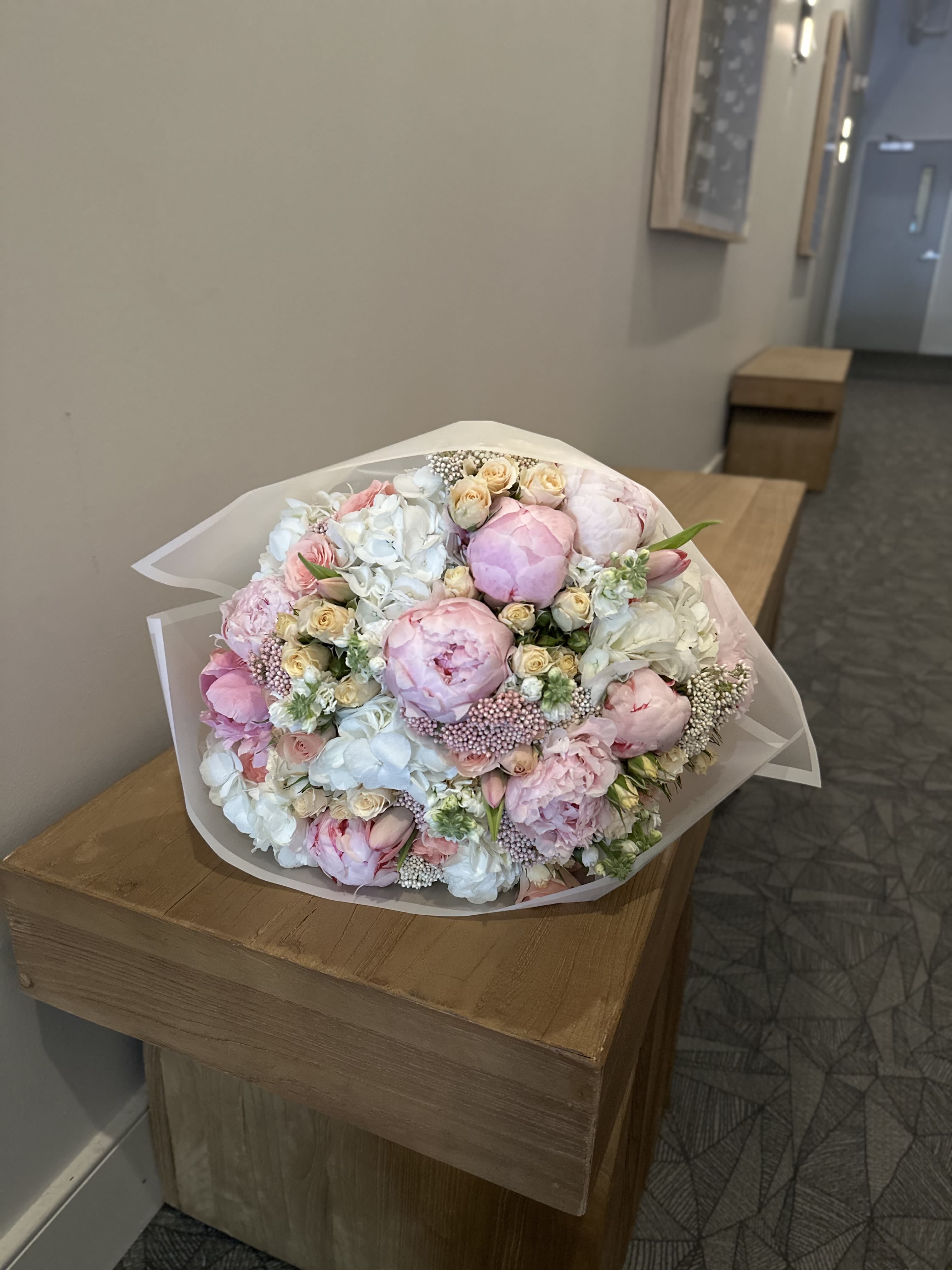 Soft Bloom - A delicate bouquet of soft pink peonies, ivory roses, and creamy hydrangeas, wrapped in elegance. Soft Bloom is perfect for weddings, anniversaries, or simply celebrating love and grace. This arrangement radiates tenderness and timeless charm — a true symphony of gentle beauty.