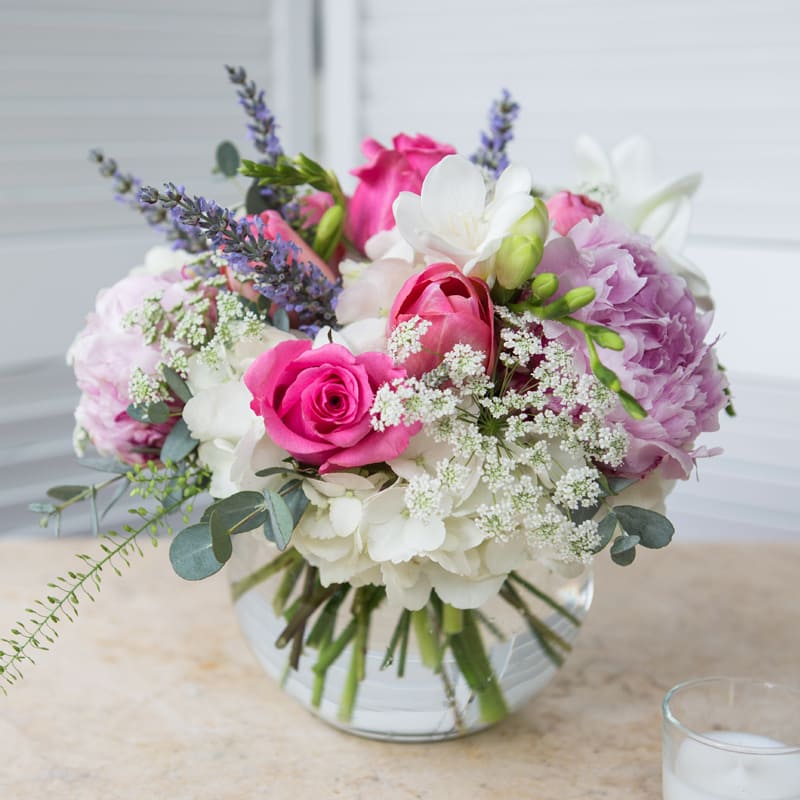 Roses, Hydrangea, and Peonies - Feminine mix featuring roses, hydrangeas, and peonies in a bubble bowl. Peonies are not available year round in our area, substitutions will be made