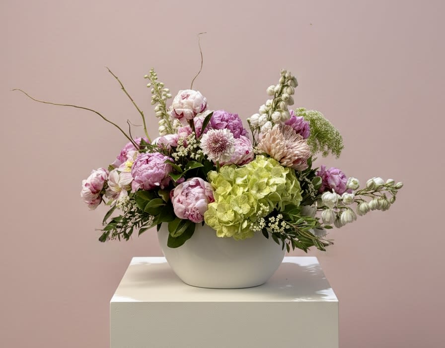 Pink Peony Affair - A luxurious arrangement of lush pink peonies, thoughtfully designed to feel romantic, soft, and unforgettable. Full, delicate petals create an elegant statement—perfect for celebrating love, meaningful moments, and grand gestures.  Bloom availability may vary based on the season to ensure the freshest flowers.