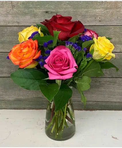 Half Dozen Mixed - A beautiful vased arrangement containing 6 different colored roses! (Colors may vary)