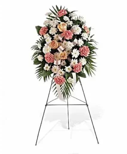 Gentle Harmony - Express your deepest sympathies, and extend a gracious note to a service or memorial, with this soft spray of pink and white blooms surrounded by a frame of elegant greens.