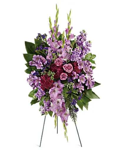Lavender Remembrance - This lovely spray features lavender roses, lavender alstroemeria, lavender gladioli, lavender stock, purple cushion spray chrysanthemums, purple sinuata statice, oregonia and lemon leaf.