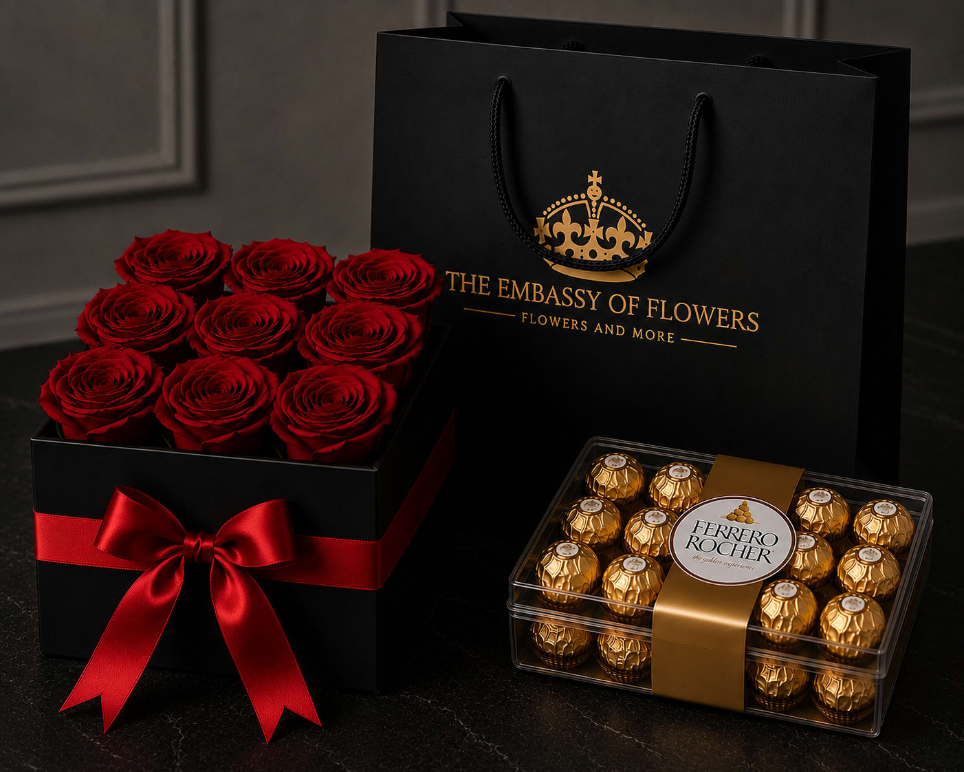 Combo Red Velvet Rose Box - Make a lasting impression with our Combo Red Velvet Rose Box, a sophisticated gift designed for life's most meaningful celebrations. This elegant arrangement features twelve premium fresh red roses beautifully arranged in a luxurious black keepsake box and accented with a rich red satin ribbon for a timeless and romantic presentation.  Paired with a delicious box of Ferrero Rocher chocolates and presented inside our signature black paper gift bag with gold accents, this collection delivers an unforgettable gifting experience from the moment it arrives.  Whether celebrating love, an anniversary, a birthday, Valentine's Day, or simply expressing appreciation, this exquisite gift combines elegance, beauty, and indulgence in one stunning presentation.  Includes: premium fresh red roses Luxury black keepsake box Elegant red satin ribbon Ferrero Rocher chocolates Signature black paper gift bag Complimentary message card