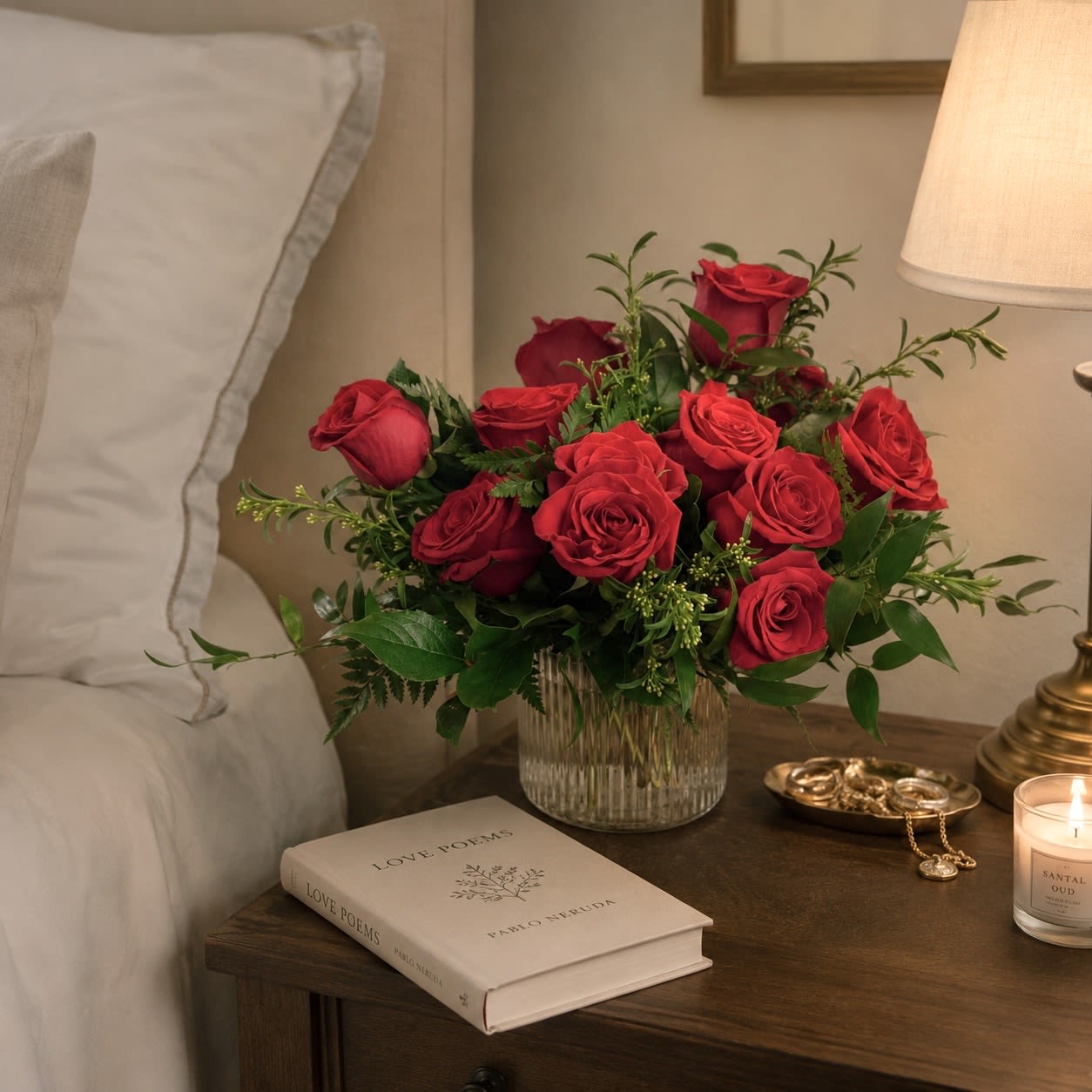 The Lush Dozen  - The Lush Dozen is for the person who is loves a classic but with a stylish update. Roses are densely arranged in a ribbed cylinder with deep mixed greenery.  Upgrade to Deluxe for 18 roses; Premium for 24 roses in a larger ribbed vase.