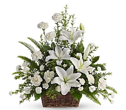 Peaceful White Lilies Basket - Gorgeous flowers such as white lilies, carnations and miniature carnations mix with vibrant greens in a large basket. Simply stunning.