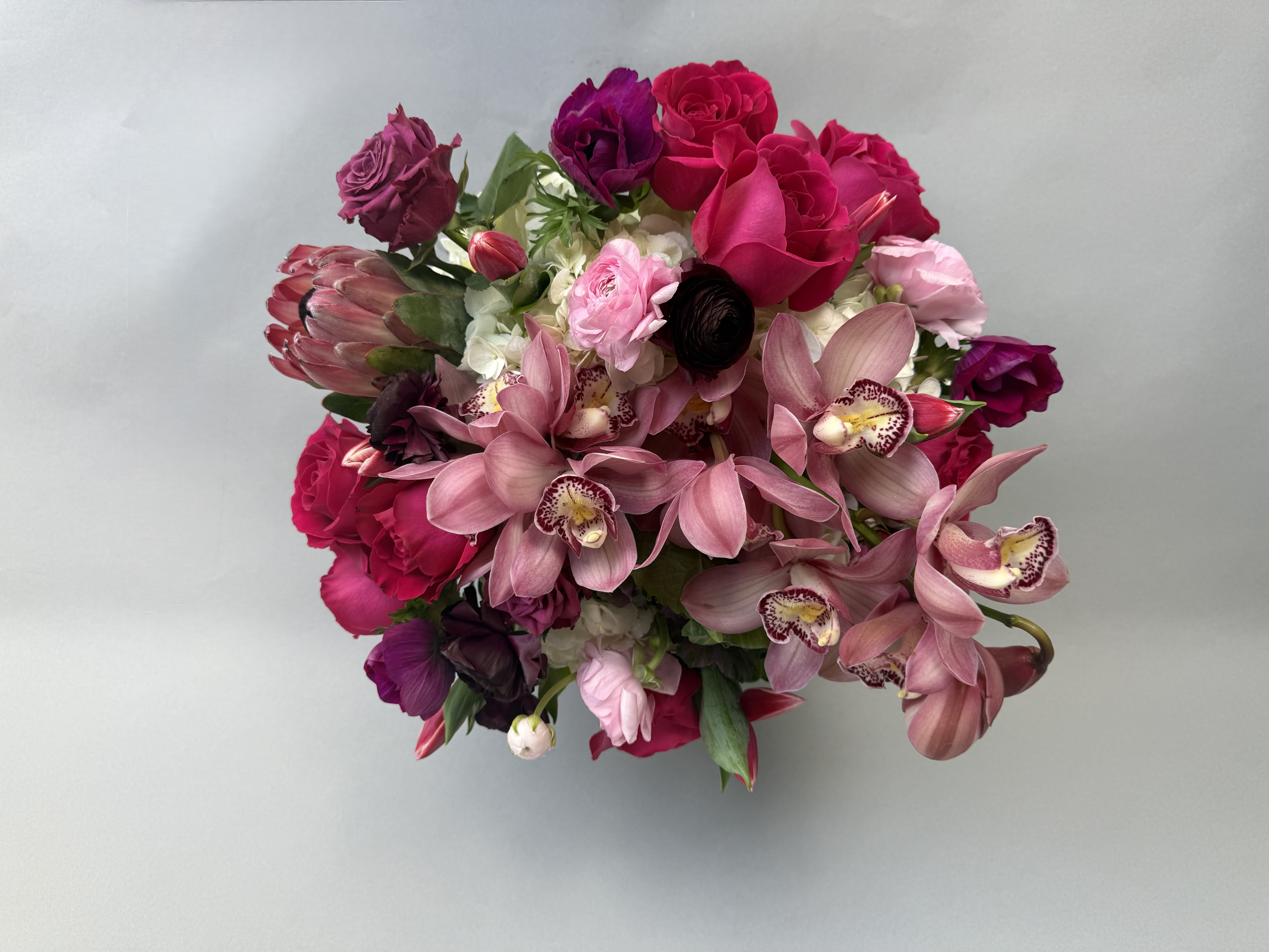 Gift Card.  - Give the gift of choice with a physical gift card that lets the person you're thinking of browse and order beautiful flower arrangements, bouquets, and gifts. Perfect for birthdays, anniversaries, Mother's Day, Valentine's Day, or to say thank you, this gift lets them pick from romantic roses, elegant orchids, lush hydrangeas, and seasonal mixes in pink, purple, white, and red - the kind of palette that feels celebratory and feminine.  They can use the card to select a full-size bouquet, a compact posy, or an arrangement to match a special moment, choosing colors and flowers that suit their taste. Ideal for anyone who loves floral surprises, the card gives them the freedom to customize delivery date, add a vase or gift extras, and ensure the arrangement arrives fresh. Add a personal message at checkout and we'll handle the rest - an effortless way to make someone feel truly seen.