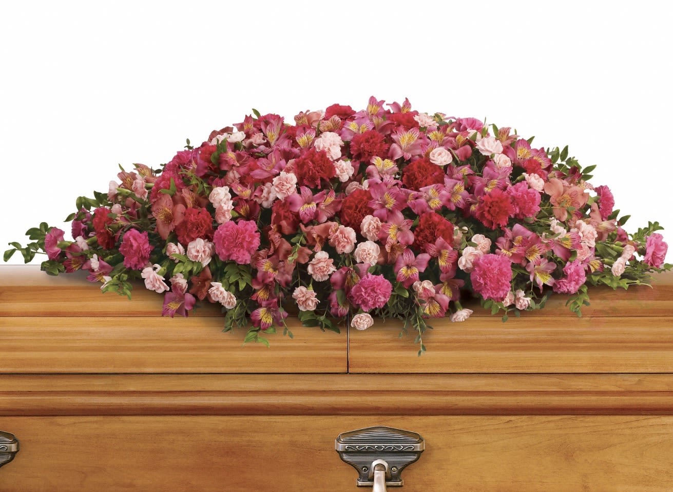 A LifeLoved Casket Spray - A full, layered casket spray in soft romantic hues-designed to honor a cherished life with dignity and warmth. This funeral casket spray places pink and red carnations alongside striped alstroemeria and pale accents across the top of a wooden casket, creating a dense, low profile that feels both formal and tender. As a sympathy arrangement, it reads as a thoughtful tribute that will help the person you're remembering feel honored and truly loved.  The arrangement's ruffled carnations provide texture and volume while the smaller alstroemeria add delicate patterning and movement; touches of white and green lift the palette and offer quiet contrast against the wood. Because it's crafted to lay across the casket, the spray is substantial in size and intended for viewing from all sides, making it suitable for traditional services and memorial gatherings. For ordering, please let us know any personalization requests or delivery details so we can ensure the spray complements the service and setting.