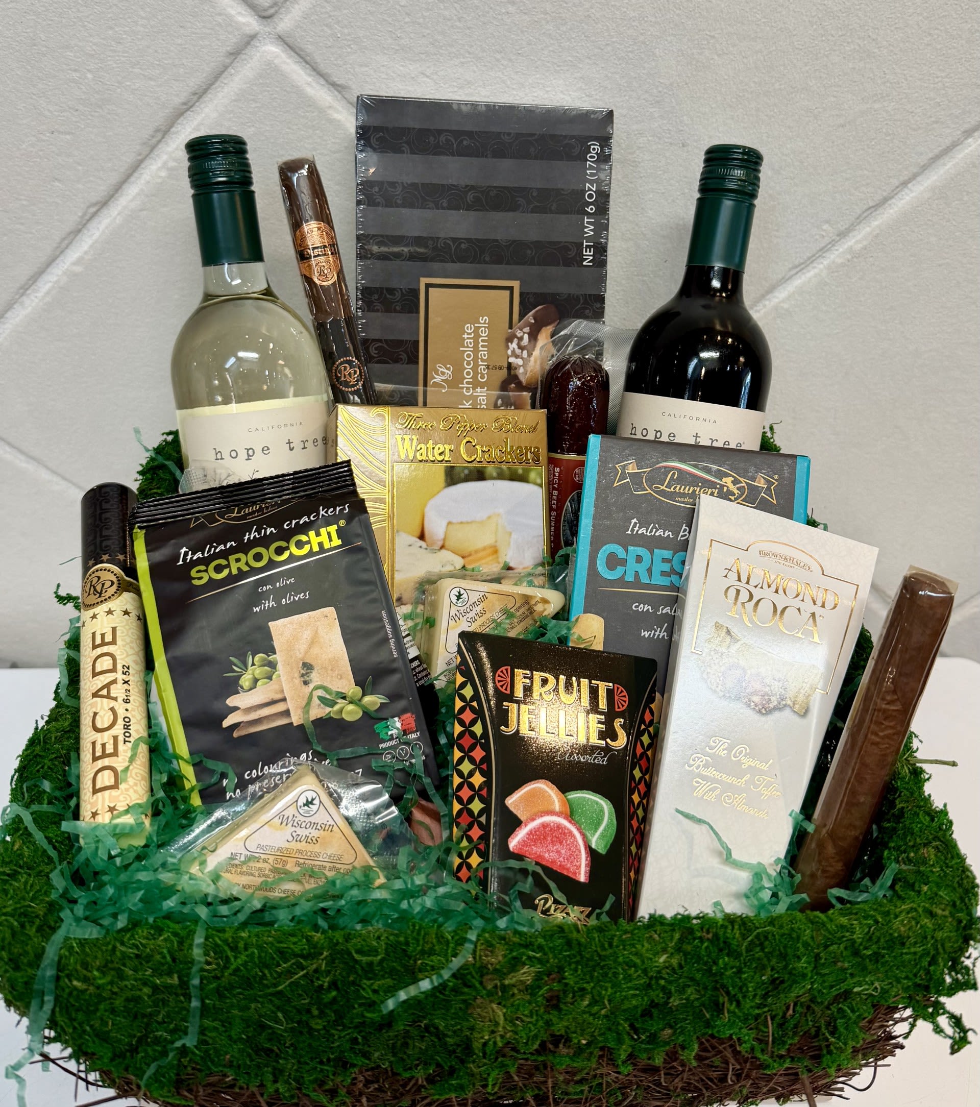 Afternoon Delight - This gift basket includes 2 bottles of wine, gourmet snacks and the finest cigars by Rocky Patel. 
