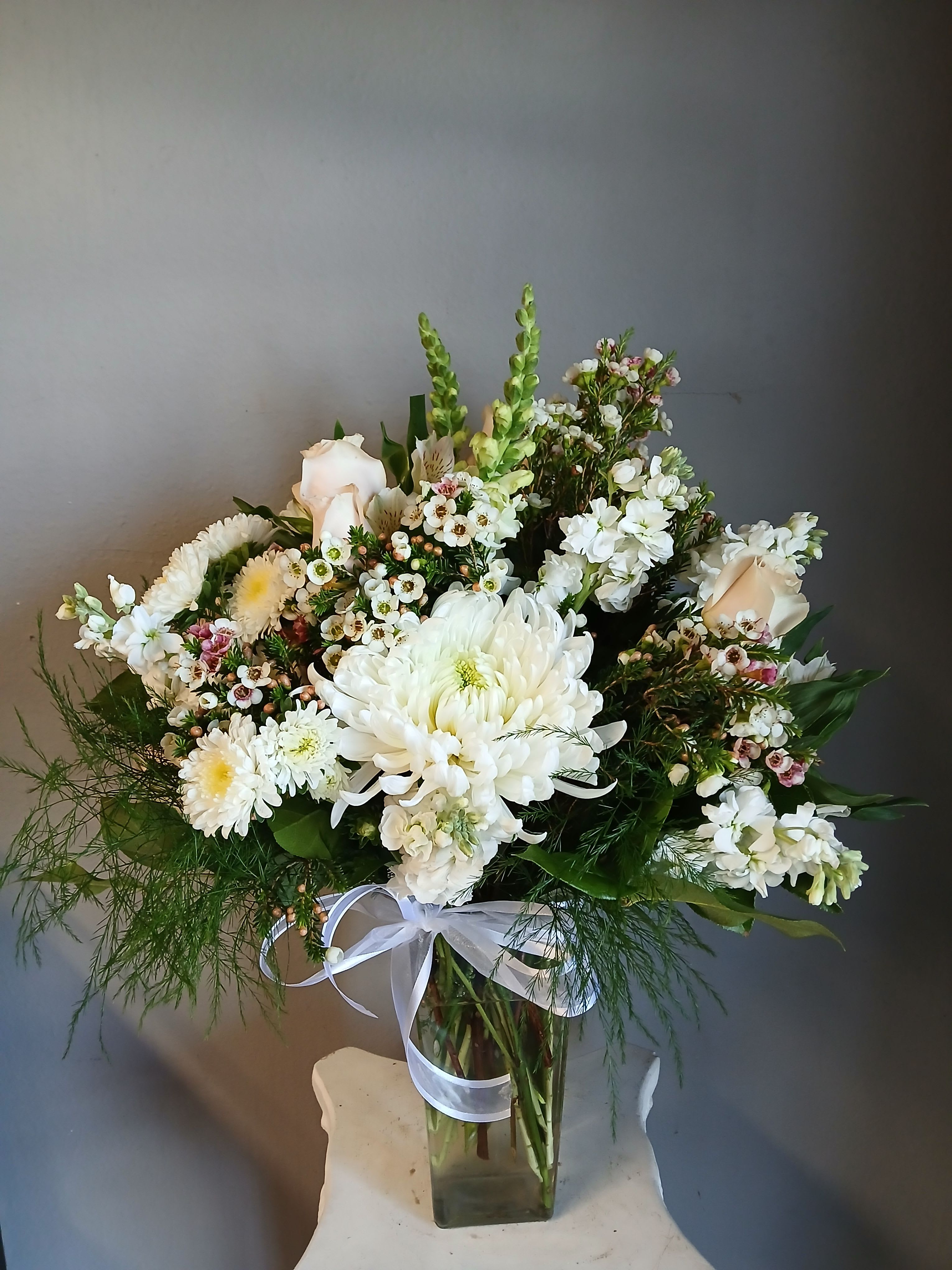 #797 Soft and Sweet - A soft, garden-inspired bouquet that feels calm and comforting-perfect as a sympathy arrangement, wedding centerpiece, or a gentle birthday bouquet. This flower arrangement places white chrysanthemums and pale blush roses at its heart, with tall green snapdragon spikes lifting the design for graceful height and a layered, natural silhouette 