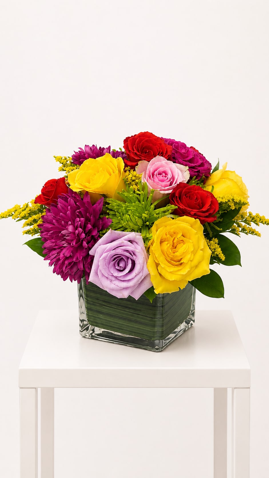 Colorful Garden Cube ™ - A cheerful and vibrant flower arrangement, thoughtfully designed in a modern glass cube. Created with a curated selection of fresh, premium blooms in bright and uplifting colors, this design brings warmth, joy, and a fresh pop of color to any space. Full, balanced, and effortlessly elegant, it’s perfect for any occasion.  Each arrangement is Designer’s Choice, carefully created with fresh seasonal blooms. Flower varieties and color tones may vary based on availability while preserving the overall style, palette, and value.  Perfect for birthdays, thank you gestures, get well wishes, congratulations, Mother’s Day, or sending a bright “just because” surprise to uplift someone’s day.  Same day flower delivery available in Southwest Florida, including Naples, Bonita Springs, and Fort Myers Beach.