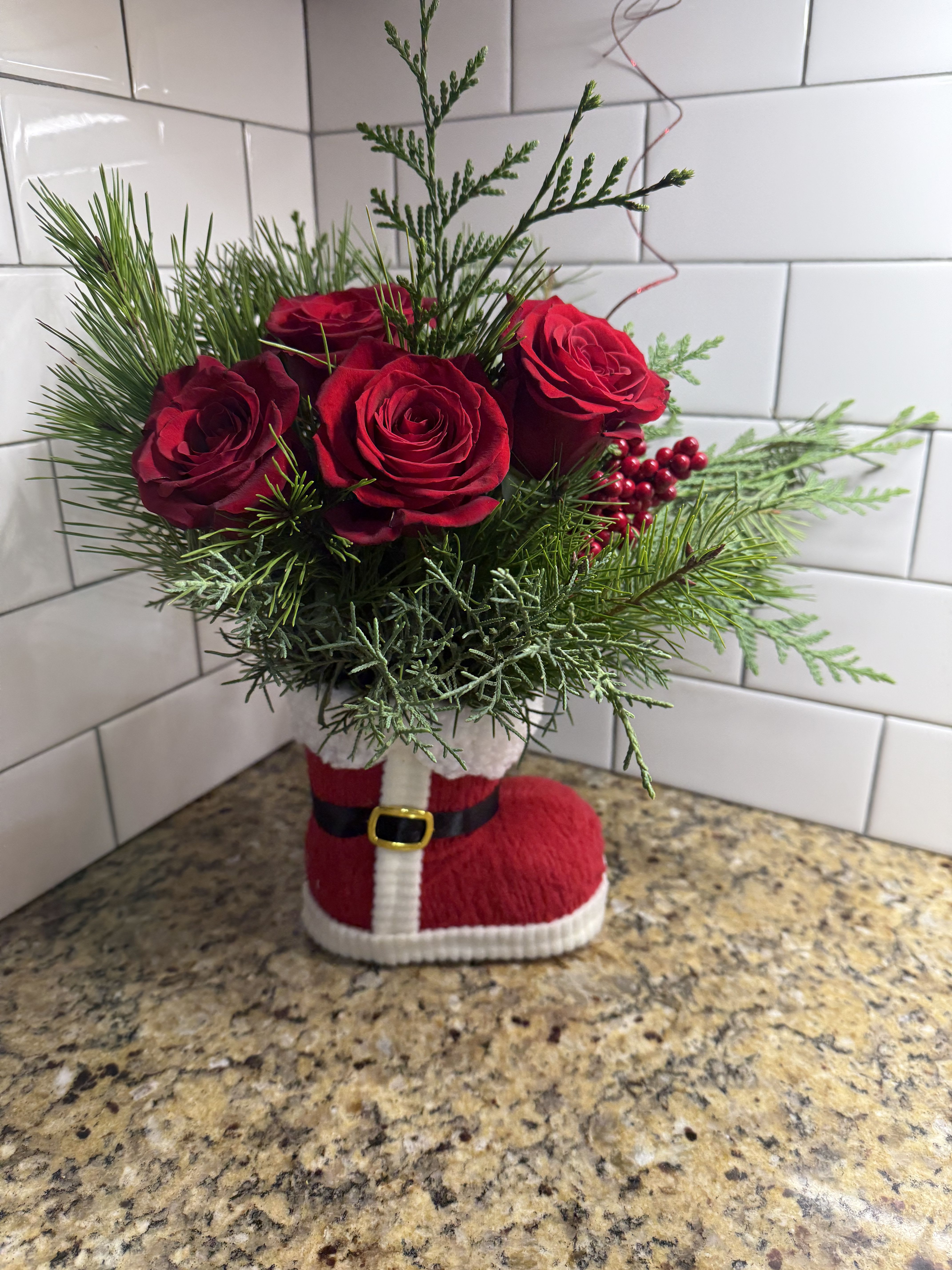 Santa’s Boot - Filled with Christmas greenery and fresh red roses!