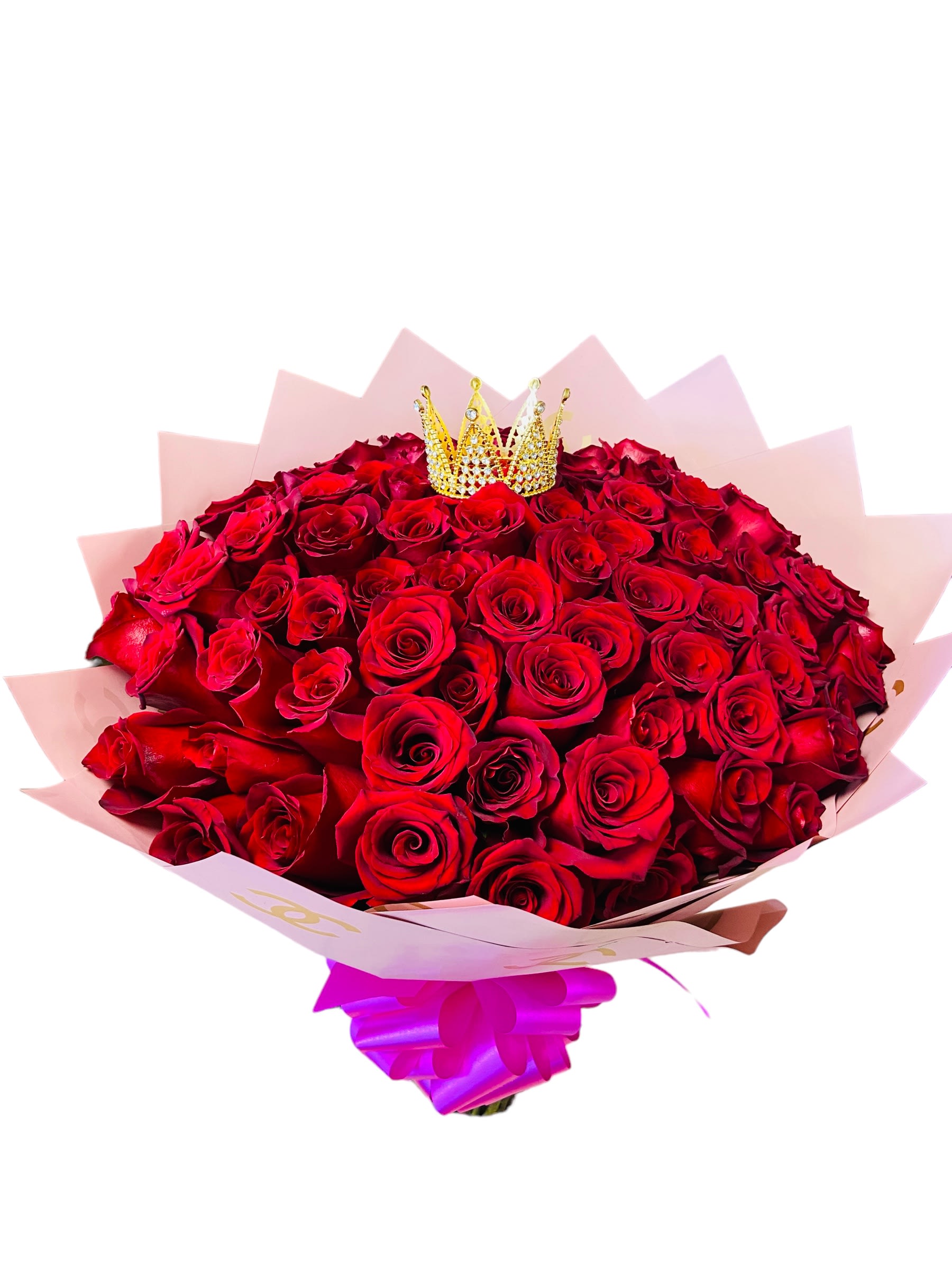 Bouquet of red roses with a small crown topper and pink wrapping
