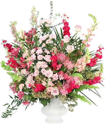 Uplifting Harmony Sympathy Flowers - Lift them in support with this stunning arrangement. Featuring a mix of pink and lavender florals such as roses, mini carnations, snapdragons, and more, this bold and comforting arrangement is a soothing reminder in times of grief. Uplifting Harmony is a comforting touch during life’s difficult moments.  Includes: Purple Alstroemerias , Bells Of Ireland , Pink Mini Carnations , Antique Hydrangeas , Pink Larkspur , Light Pink Roses , Pink Snapdragons , Lavender Spider Mum , Raspberry Stock , Waxflower , Lavender Daisy Poms , Greens: Baby Blue Eucalyptus, Seeded Eucalyptus, Italian Ruscus, Tepe Palm, Sword Fern , White Urn .