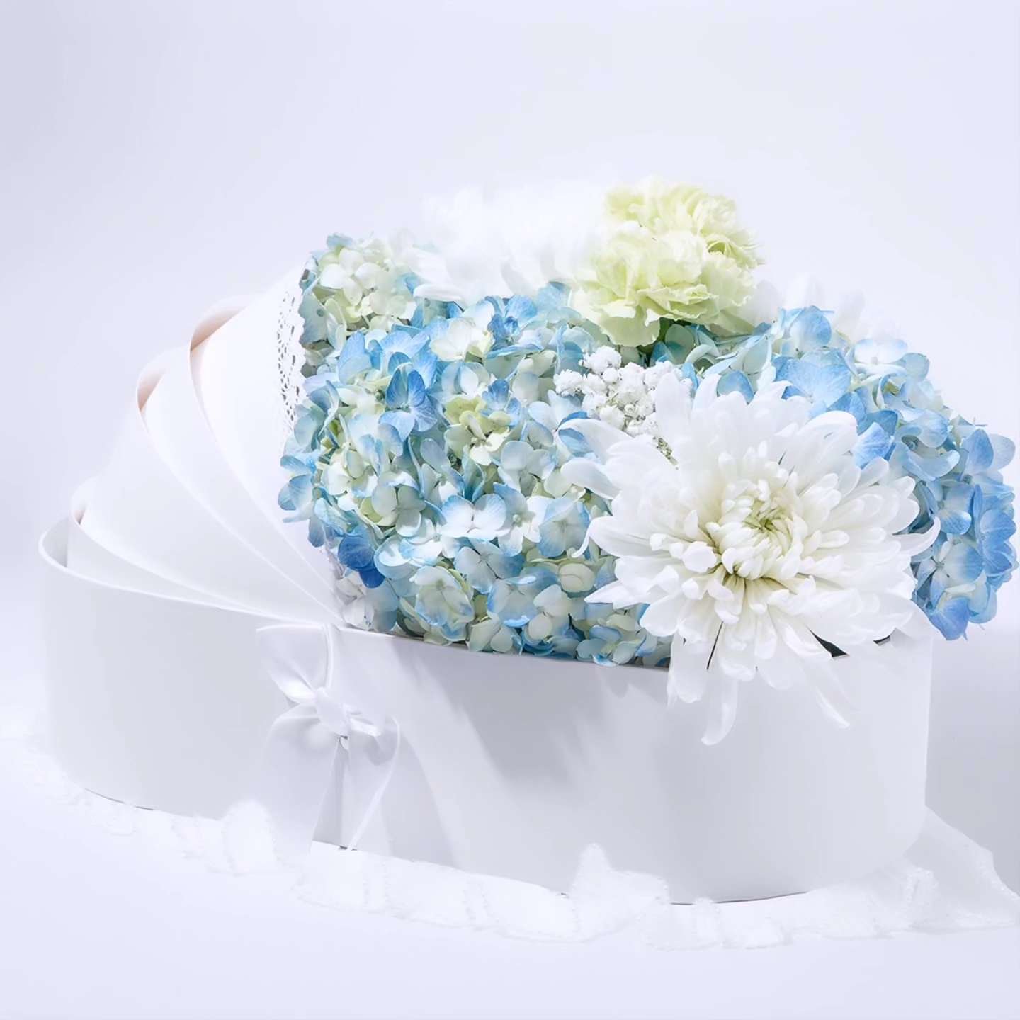 Baby box  - “Welcome Little One – Boy Edition” Celebrate the arrival of a precious baby boy with this charming baby floral box. Designed in soft blue and white tones, it features delicate blooms arranged with love and care. Accented with baby-themed decor like mini booties, a pacifier, or a ribbon bow, it’s the perfect gift to congratulate new parents and welcome their bundle of joy.  