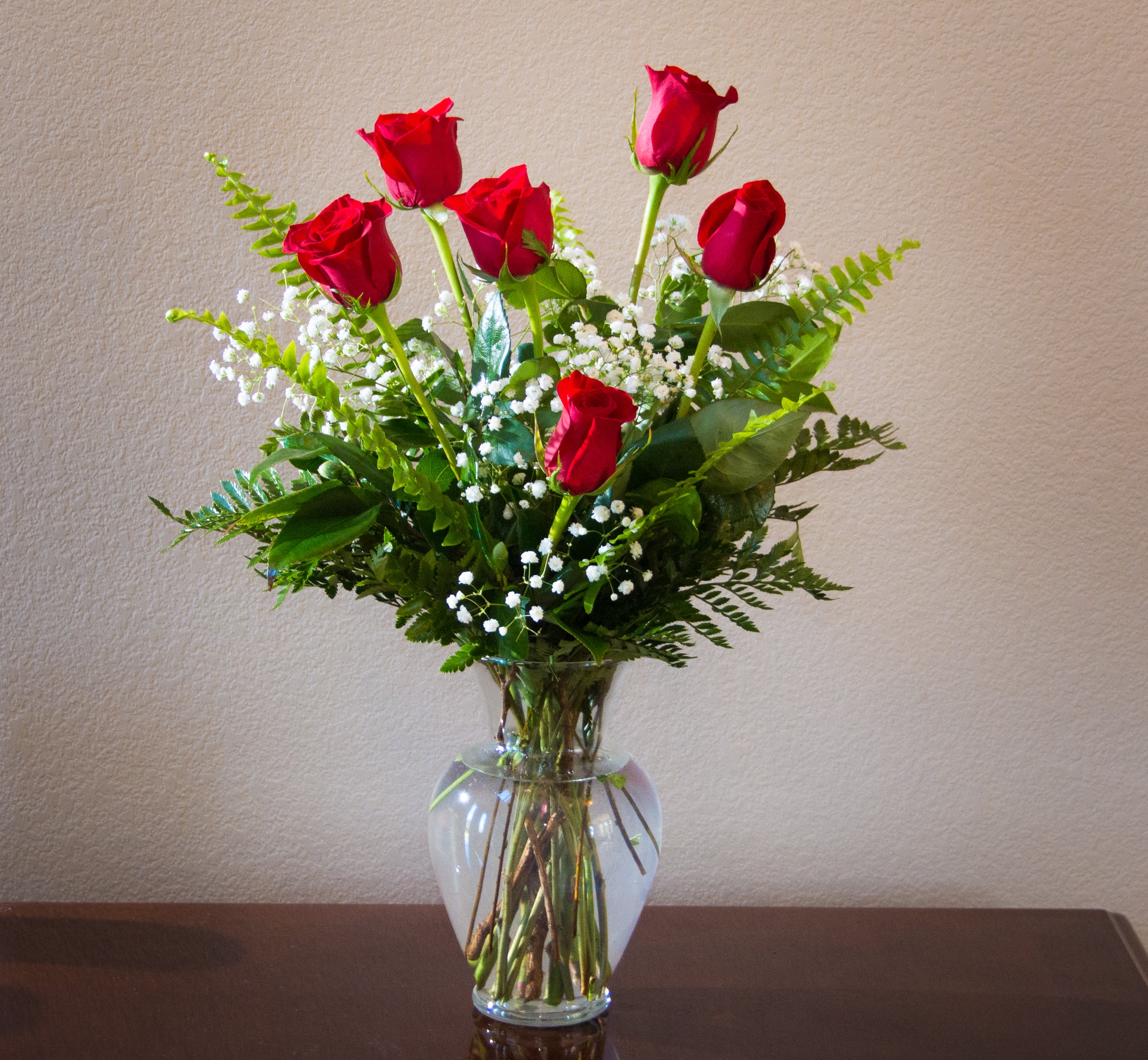Beautiful Roses  - Half Dozen Roses  with filler and greenery . Available this week  in yellow. red. Lavender or mixed colors .  