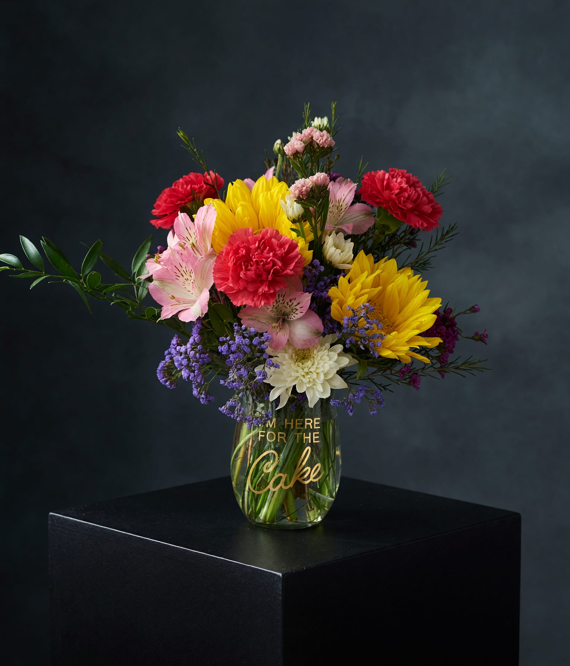 Here for Cake Bouquet - A bright and joyful birthday flower arrangement designed in a stemless wine glass featuring vibrant, seasonal blooms in playful, celebratory color. This fun and modern birthday bouquet is perfect for cake table styling, surprise deliveries, and same-day birthday flower delivery in Surprise, AZ and surrounding areas.  Designed to bring instant happiness, this compact celebration piece is ideal for birthdays, office surprises, and anyone who deserves flowers and cake-level excitement. Same-day local flower delivery available in Surprise, Arizona.