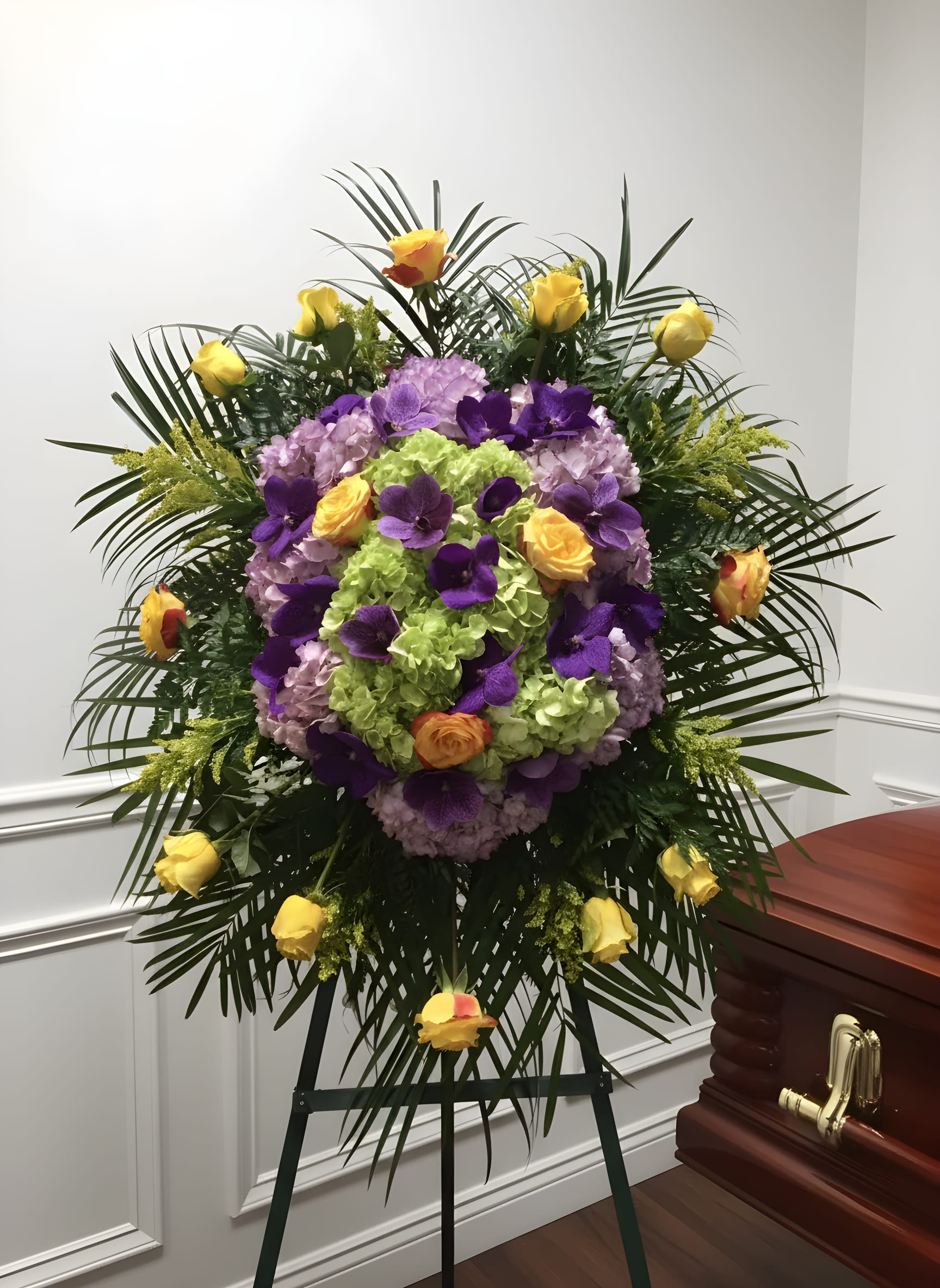 Vanda Surprise - An exquisite spray completed with purple hydrangeas, yellow roses, and purple vanda orchids. 