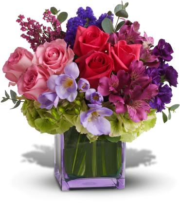 Bouquet of pink and red roses with purple flowers in a square vase
