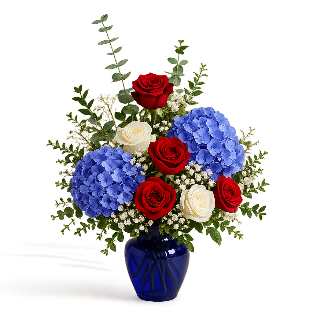 Blue Patriotic Arrangement - Celebrate with a beautifully designed patriotic floral arrangement inspired by timeless red, white, and blue tones. Each piece is thoughtfully handcrafted using the freshest seasonal blooms available and arranged in a rich blue glass vase for an elegant and classic presentation.  As a Designer’s Choice arrangement, flower varieties and floral placement may vary based on availability while maintaining the overall color palette, size, style, and premium design aesthetic shown.  Perfect for Memorial Day, 4th of July celebrations, , sympathy gestures, military tributes, or sending a meaningful seasonal arrangement.