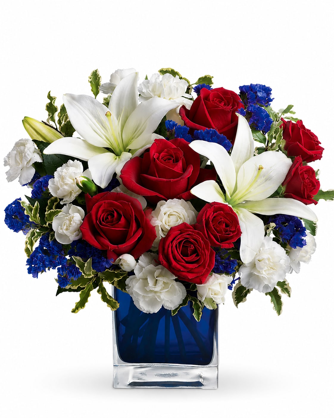 Freedom Flowers - Striking red roses and large white lilies take center stage in this patriotic flower arrangement for anniversaries, birthdays, sympathy, or a heartfelt thank-you. The Freedom Flowers arrangement combines deep red roses, pure white lilies and carnations, plus vivid blue filler blooms to create a bold red, white, and blue palette that feels both classic and celebratory-the kind of bouquet that makes the person you're thinking of feel honored and seen.  