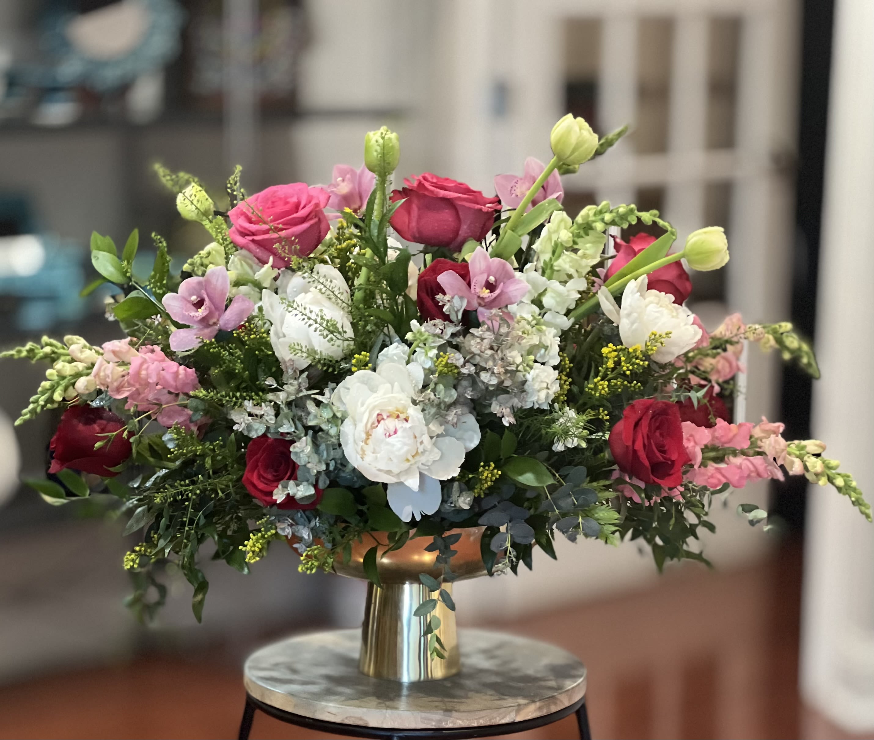 Modern Muse - A lush, rounded dome of pink, red and white blooms makes a striking centerpiece for celebrations or a romantic anniversary-this flower arrangement is a modern take on classic elegance designed to make the person you're thinking of feel truly cherished. As a full, low centerpiece or gift, it reads both polished and intimate: perfect for a dinner table, special event, or to brighten someone's day with a refined floral statement. 