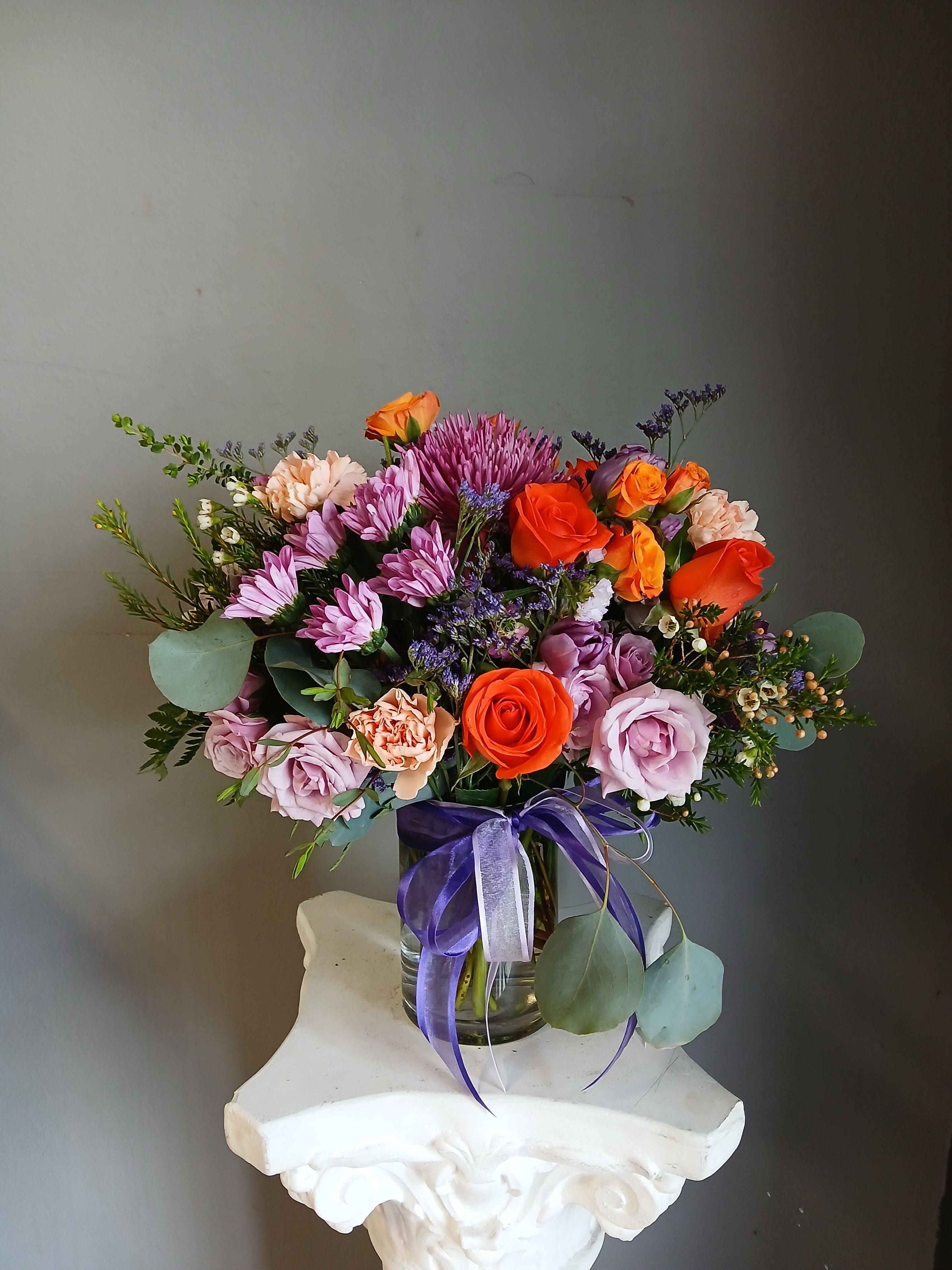 #744 Designer's Choice  - This beautiful flower arrangement of fresh mixed seasonal blooms is made by local designers in the heart Orange California. Hand crafted and perfect for a birthday. Can be sent as a local delivery or in-store pickup. This is an original, one of a kind arrangement. Order now before it's too late! 