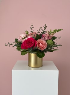 12 | J'adore - A gold pot filled with shades of pink flowers and foliage. Something that anyone will adore.