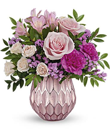 Pink and white flower arrangement in a pink textured vase