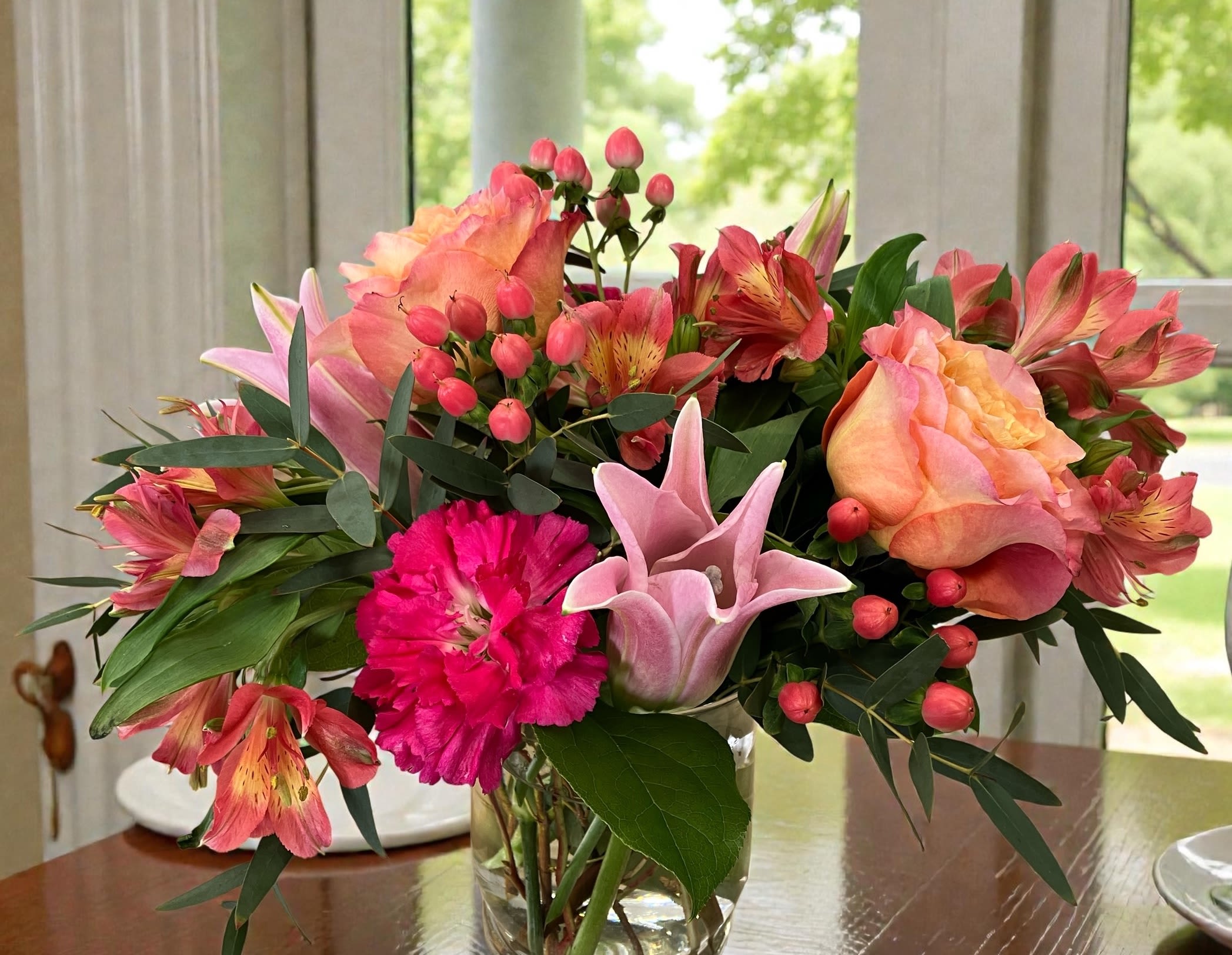 Blushing - Pink and peach tones in a lush arrangement perfect for a cheerful celebration or brightening any room.