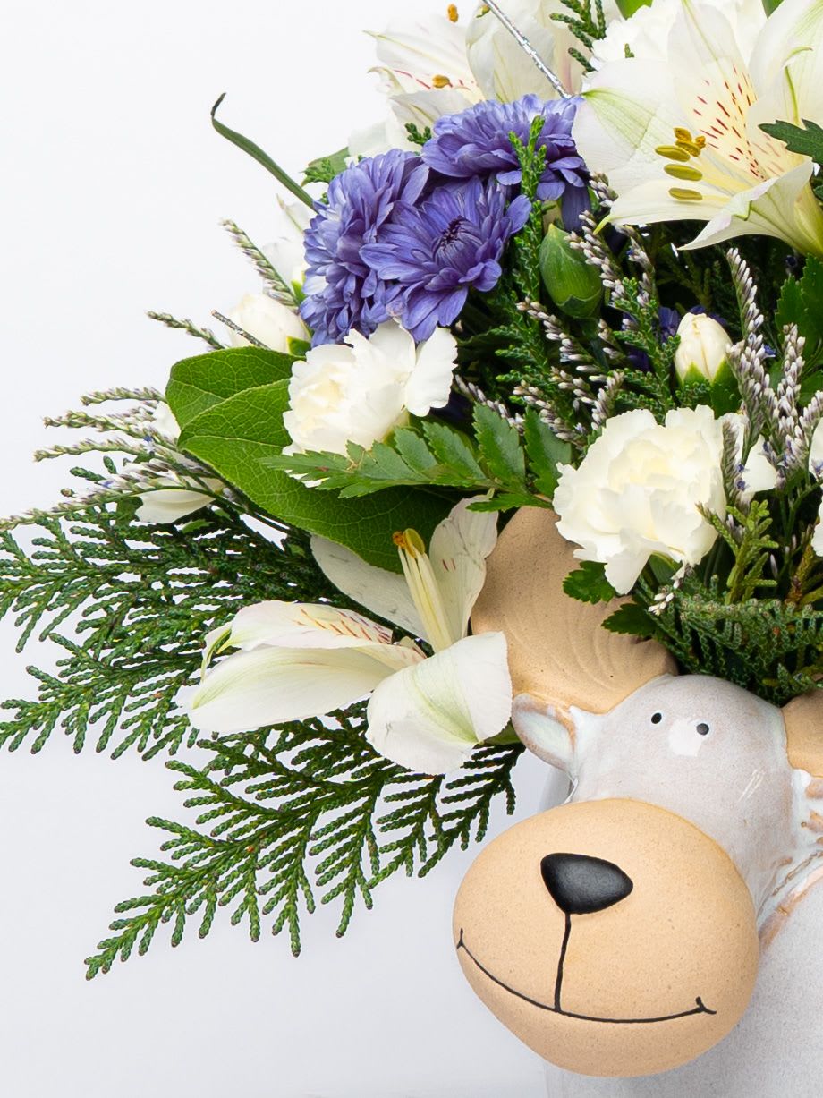 Bouquet with purple and white flowers and a teddy bear face