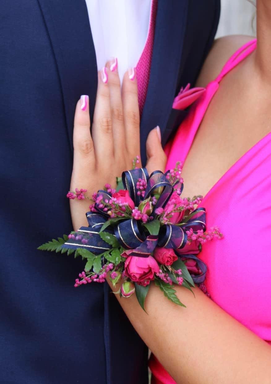 Wrist Corsage - A beautiful, classic accent for your special night. Our elegant wrist corsages are meticulously crafted with fresh, premium blooms and delicate greenery, designed to complement your attire perfectly.   Each piece is entirely custom-made to order based on your unique style, color preferences, and event needs.   Please contact the shop directly or leave your specific color and flower requests in the instructions at checkout.  Pricing is based on each piece (upon consultation)