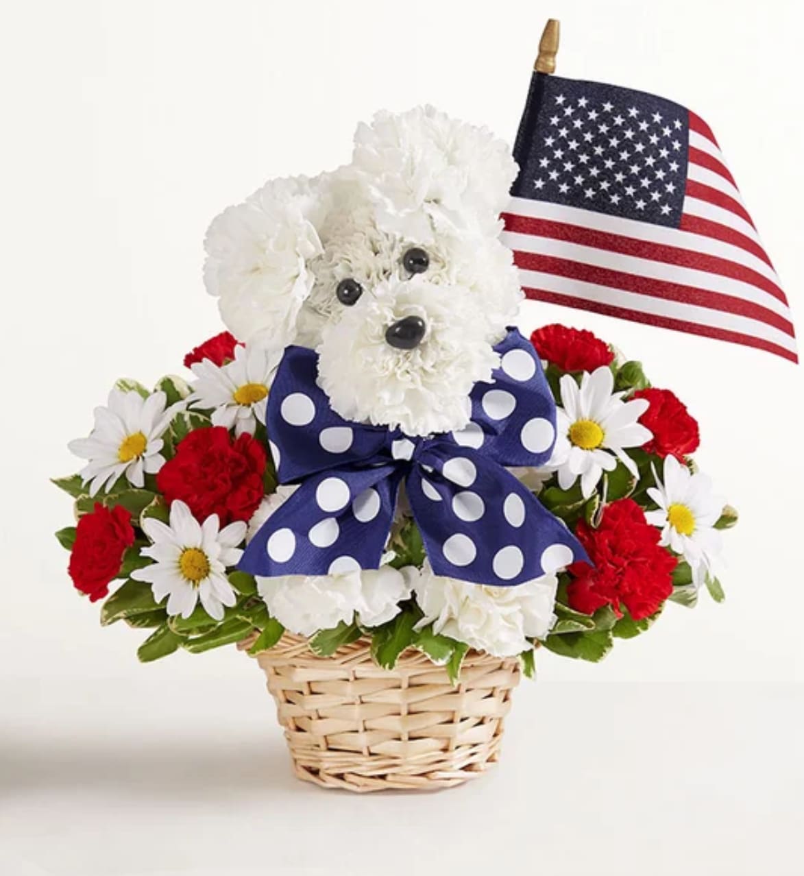 Yankee Doodle Doggie™ - Unleash smiles with our Yankee Doodle Doggie. Crafted from red and white blooms, this patriotic flower pup comes complete with a decorative ribbon and a mini American flag. Whether it’s to honor a brave service person in your life or celebrate a patriotic holiday in style, it’s truly original gift full of pride for the USA.