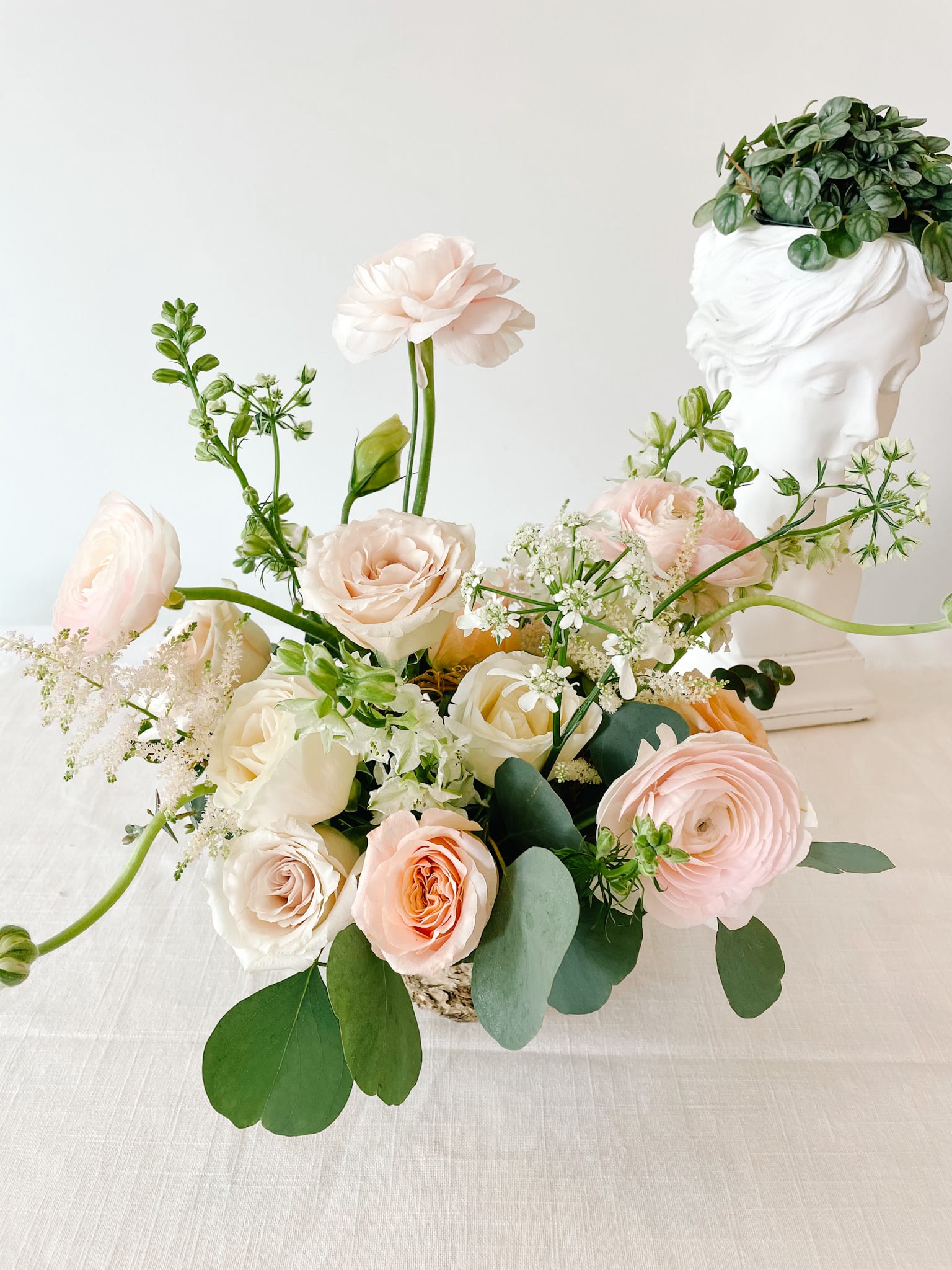 Blush and ivory rose bouquet with airy white filler flowers