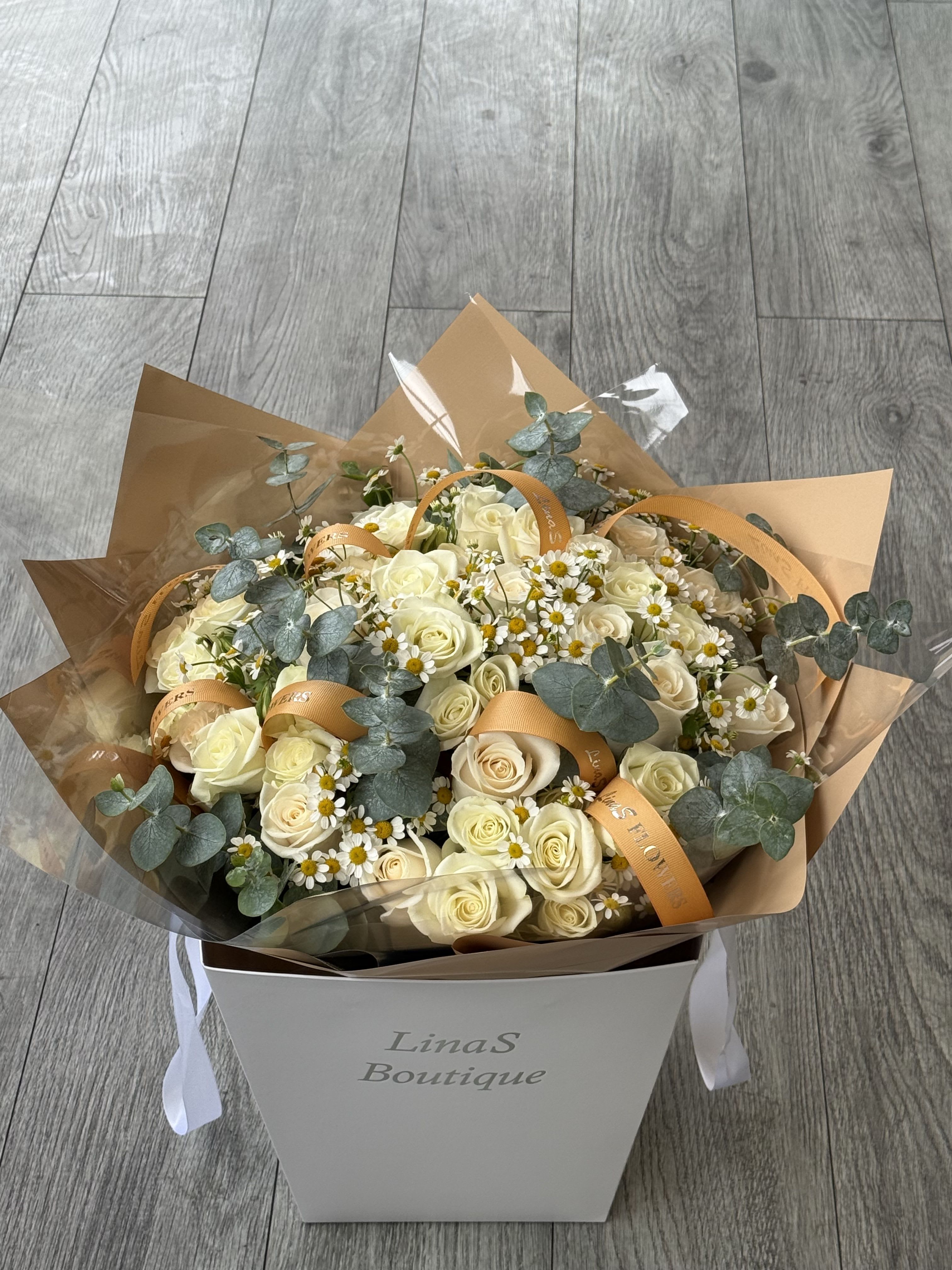 Sindi - The brown yellow rose is a unique and captivating flower, blending warm shades of brown with vibrant yellow tones. Its petals often exhibit a gradient effect, creating a striking visual appeal. This rose variety is cherished for its distinctive coloration and the symbolism of warmth, friendship, and new beginnings.
