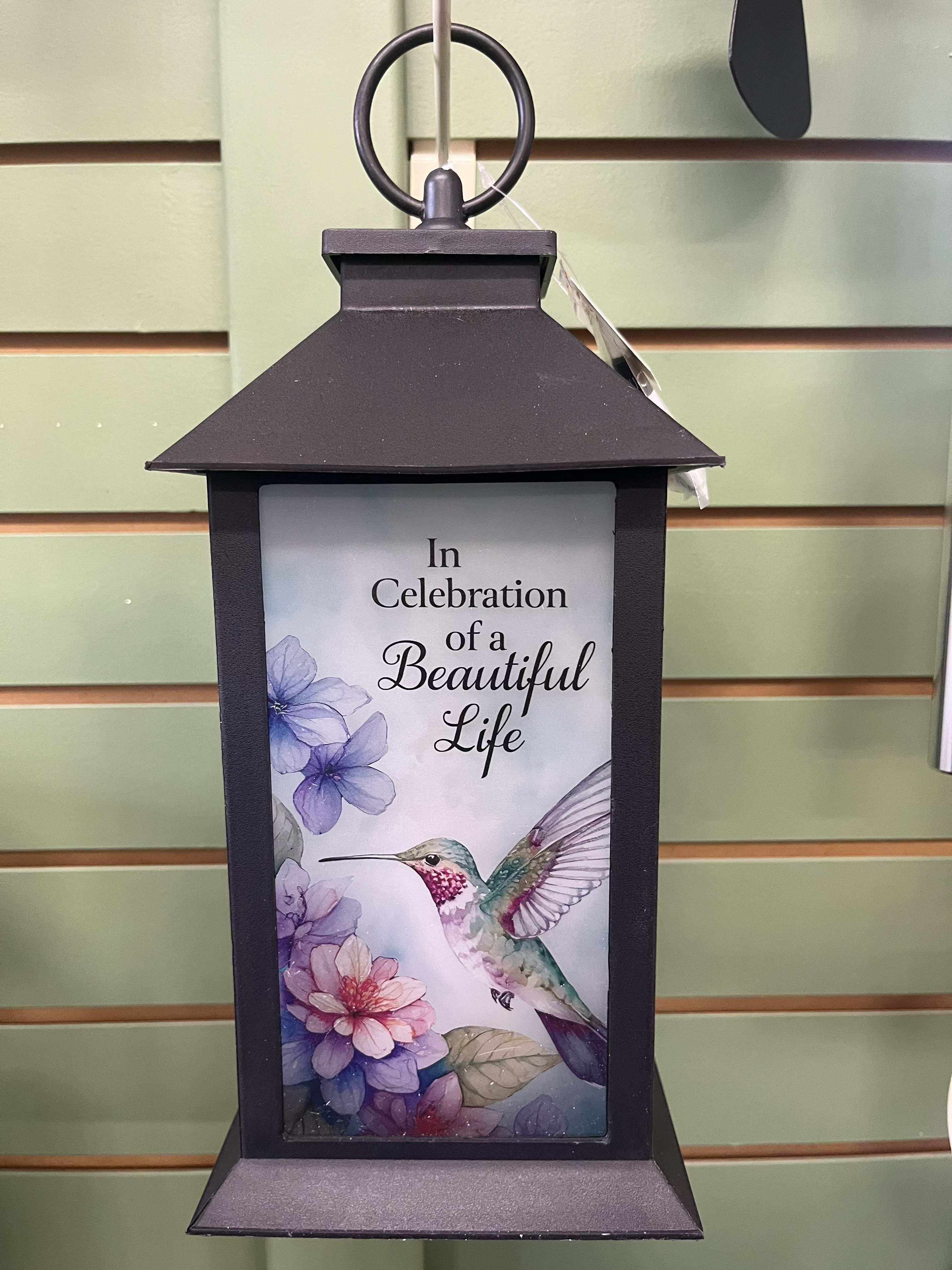 Black lantern with a hummingbird and floral memorial message