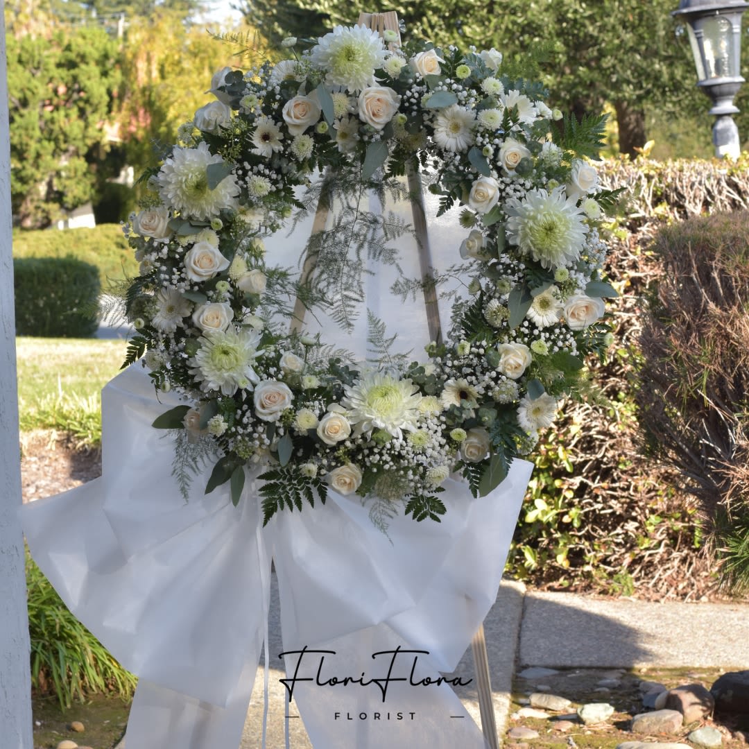 White Wreath - -18 inches Wreath or 24 inches Wreath Include: - 1 wooden stand 66 inches - 2 free Banners with Hand- Written (Max 8 Words each Banner) To Add BANNER MESSAGES ===Please Copy and Paste Below into "Special Instruction" box === Banner 1: (message here) Banner 2: (message here)  *****Please note that this wreath has to order in advance 2 days before delivery date.*****