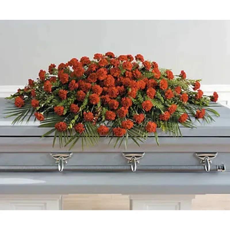 A life Well Lived Full Casket Spray - All red carnations in a beautiful design. 
