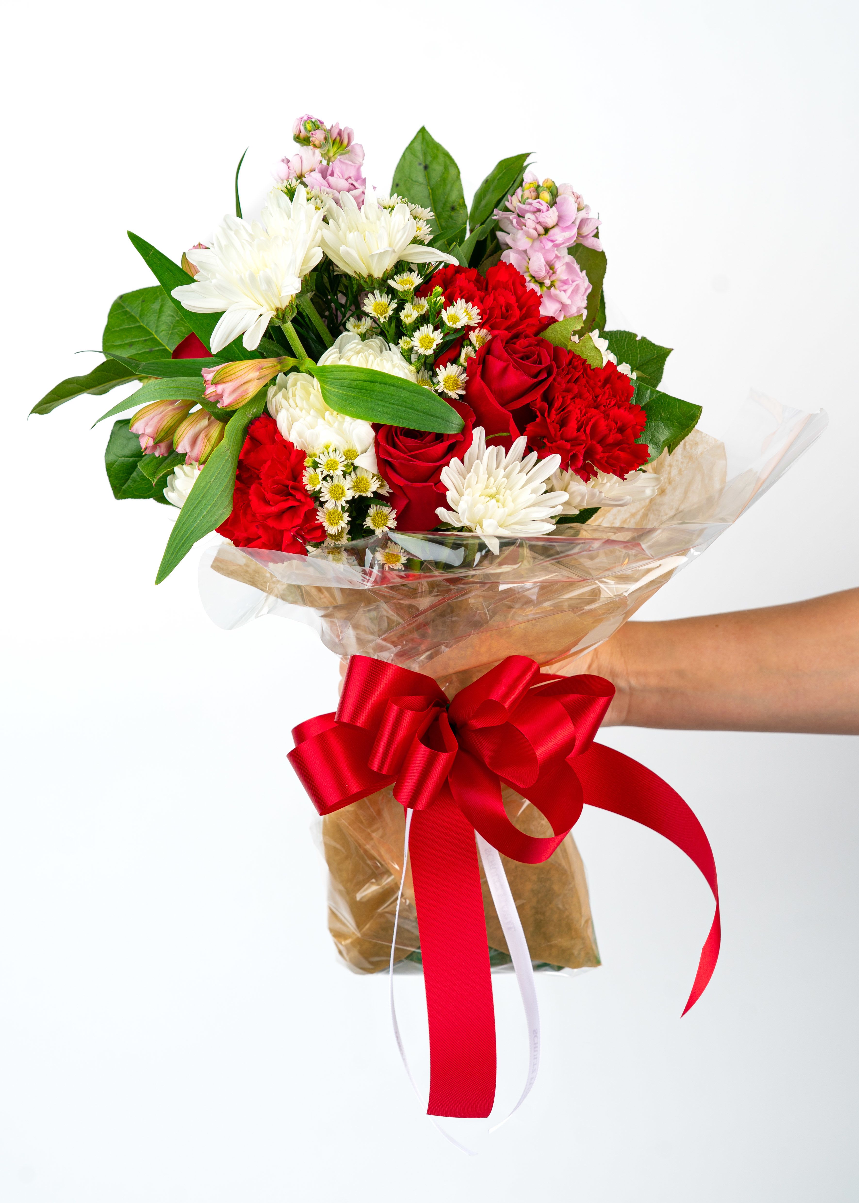 Bouquet of red and white flowers wrapped with a red ribbon