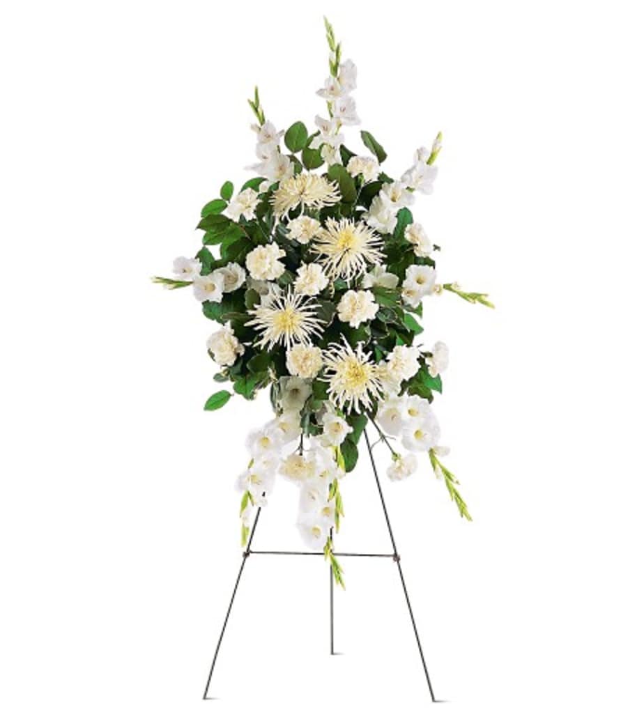 White floral standing spray on an easel