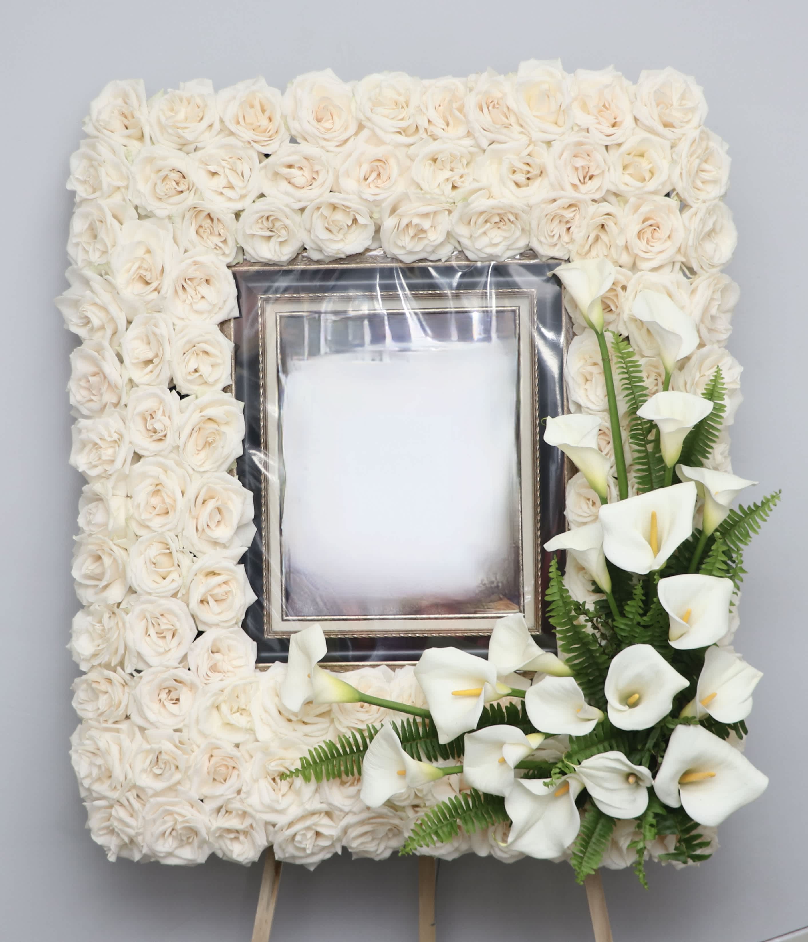 White rose and calla lily funeral frame arrangement