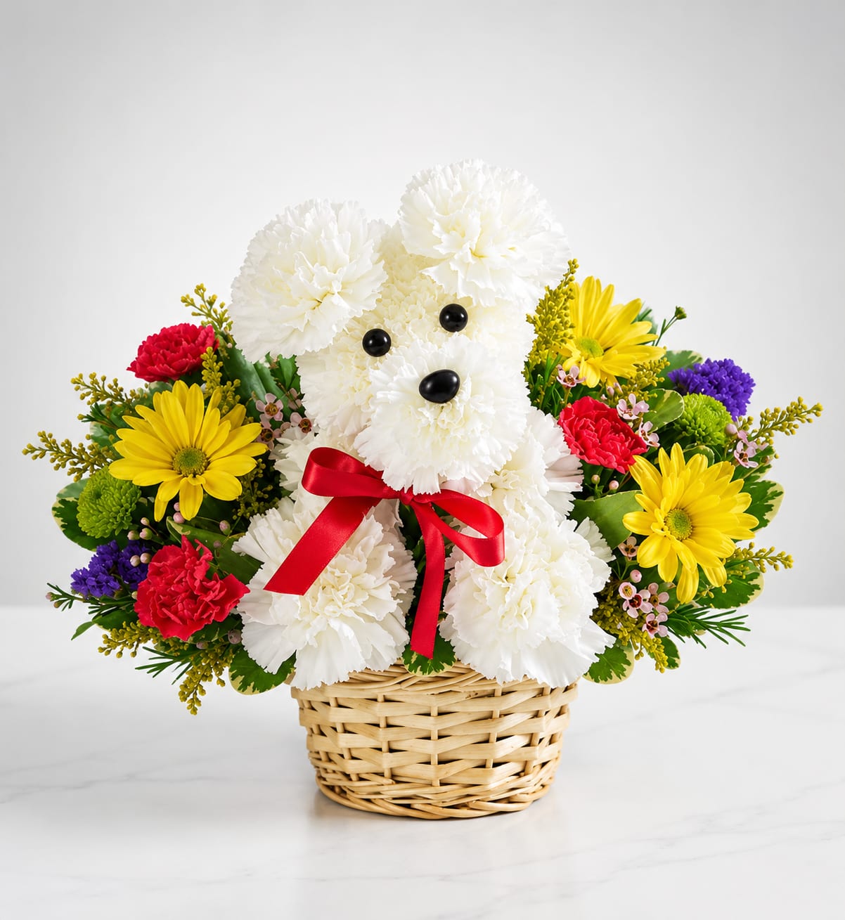Classic Puppy - Classic Puppy is an adorable handcrafted floral puppy designed with fresh white carnations and accented with cheerful yellow daisies, vibrant red carnations, and seasonal blooms. Finished with a classic red satin bow and arranged in a natural woven basket, this timeless design is a thoughtful gift for birthdays, thank you, congratulations, get well wishes, or simply to brighten someone's day.