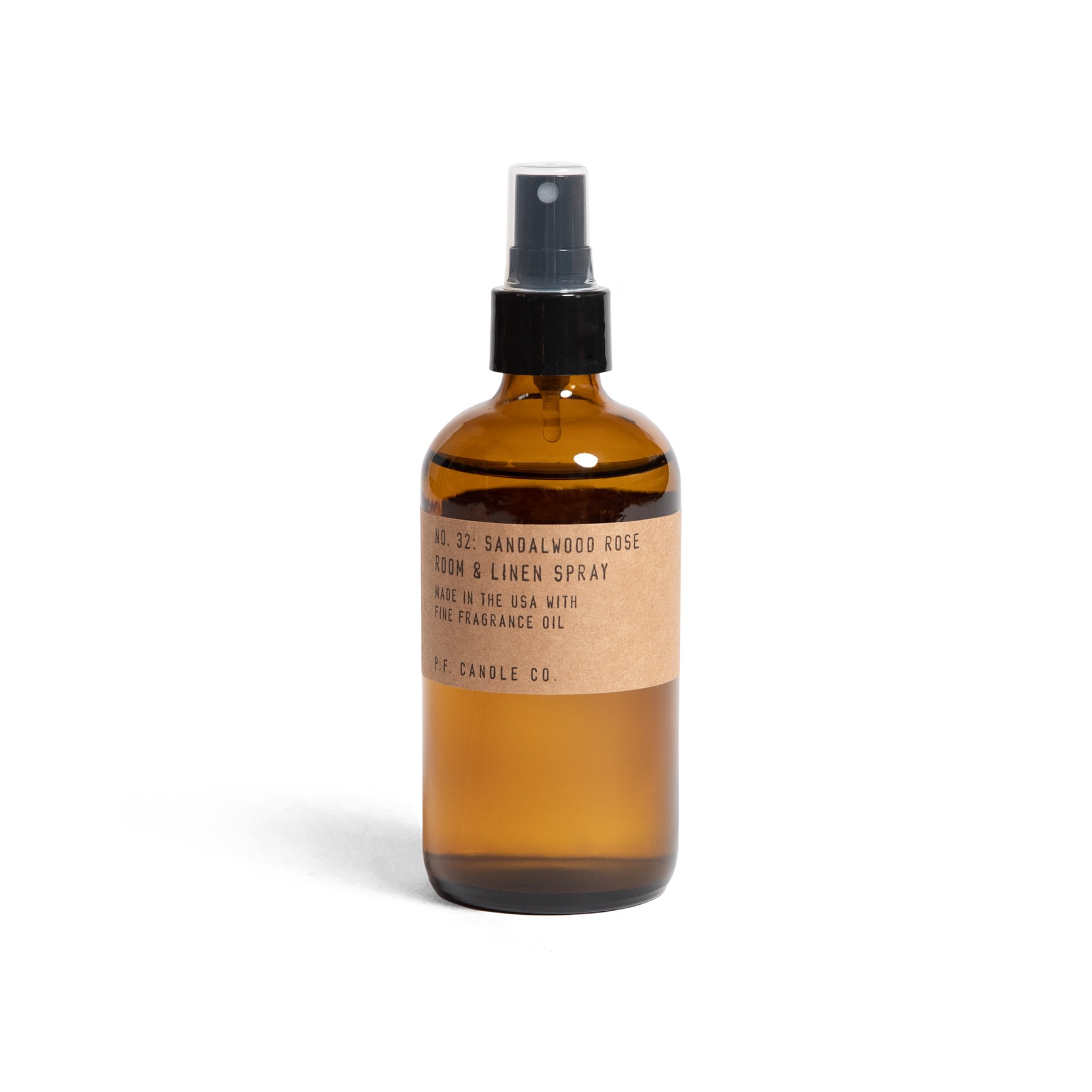 Amber spray bottle labeled sandalwood rose room and linen spray
