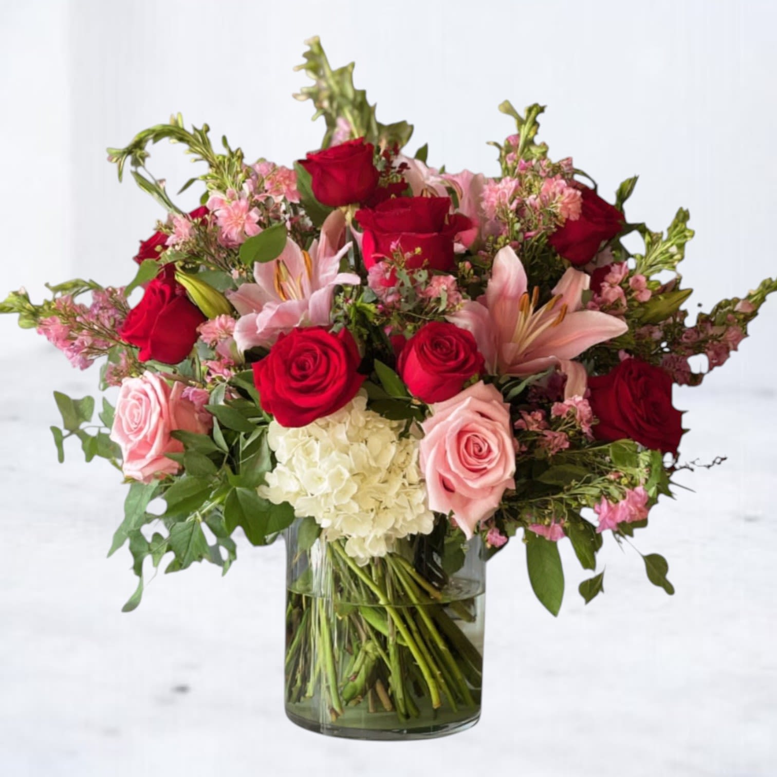 Full Bloom - Full Bloom is a bold, garden-forward arrangement designed at peak expression. Lush roses, lilies, and seasonal blooms are layered with fresh greenery for a look that feels vibrant, intentional, and unmistakably alive. Designed with movement and fullness in mind, this arrangement makes an immediate statement—perfect for celebrating, marking a moment, or simply sending something unforgettable.  Whiskey Wallflower is a design-forward florist serving Magnolia, The Woodlands, Montgomery, Willis, Conroe, Spring, Tomball and surrounding Houston-area communities. We specialize in thoughtfully composed, modern floral arrangements with a focus on premium blooms, intentional design, and reliable same-day delivery. Every piece is created with care to make life’s moments feel elevated, personal, and unforgettable.
