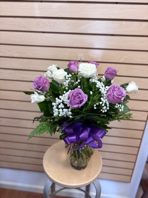 Dozen White and Lavender Roses - A rounded cluster of lavender and white roses creates an immediately soft, romantic impression-perfect as a birthday bouquet, anniversary roses, or a "thinking of you" arrangement. 